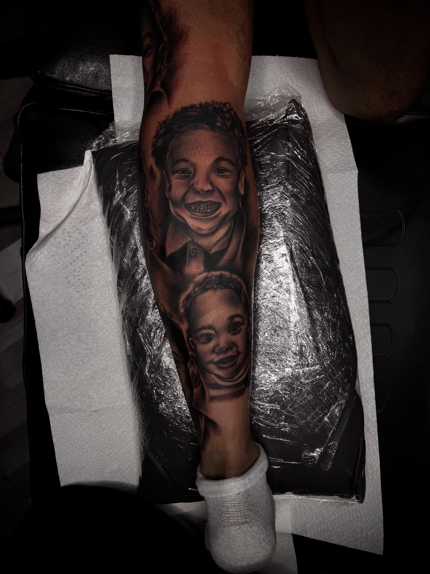 Child portraits realism tattoo on the forearm by Zeus