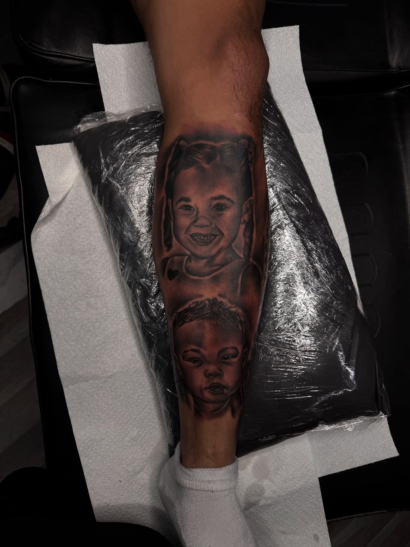 Children's portraits realism tattoo on the forearm by Zeus