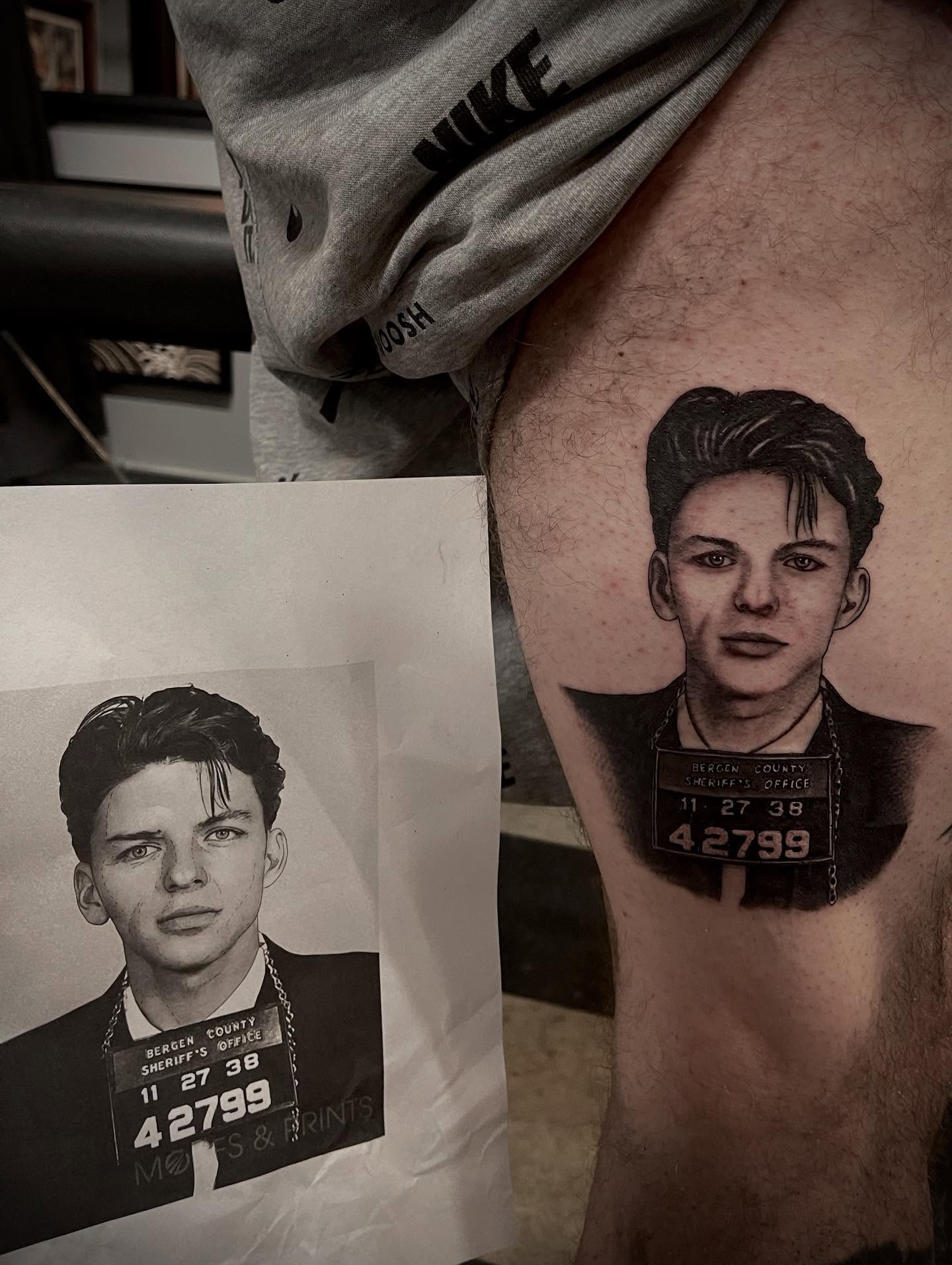 Mugshot realism tattoo on the thigh by Jacob Finelli