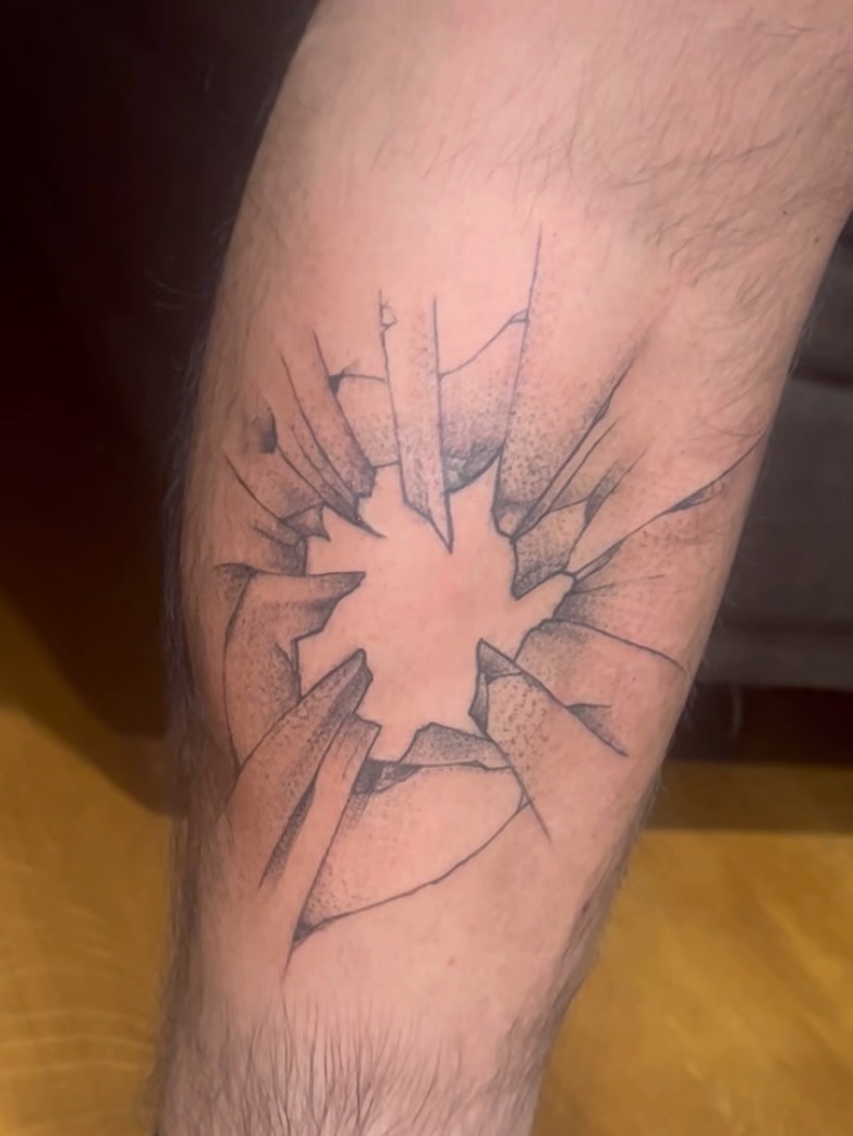 Broken glass dotwork tattoo on the forearm by zion