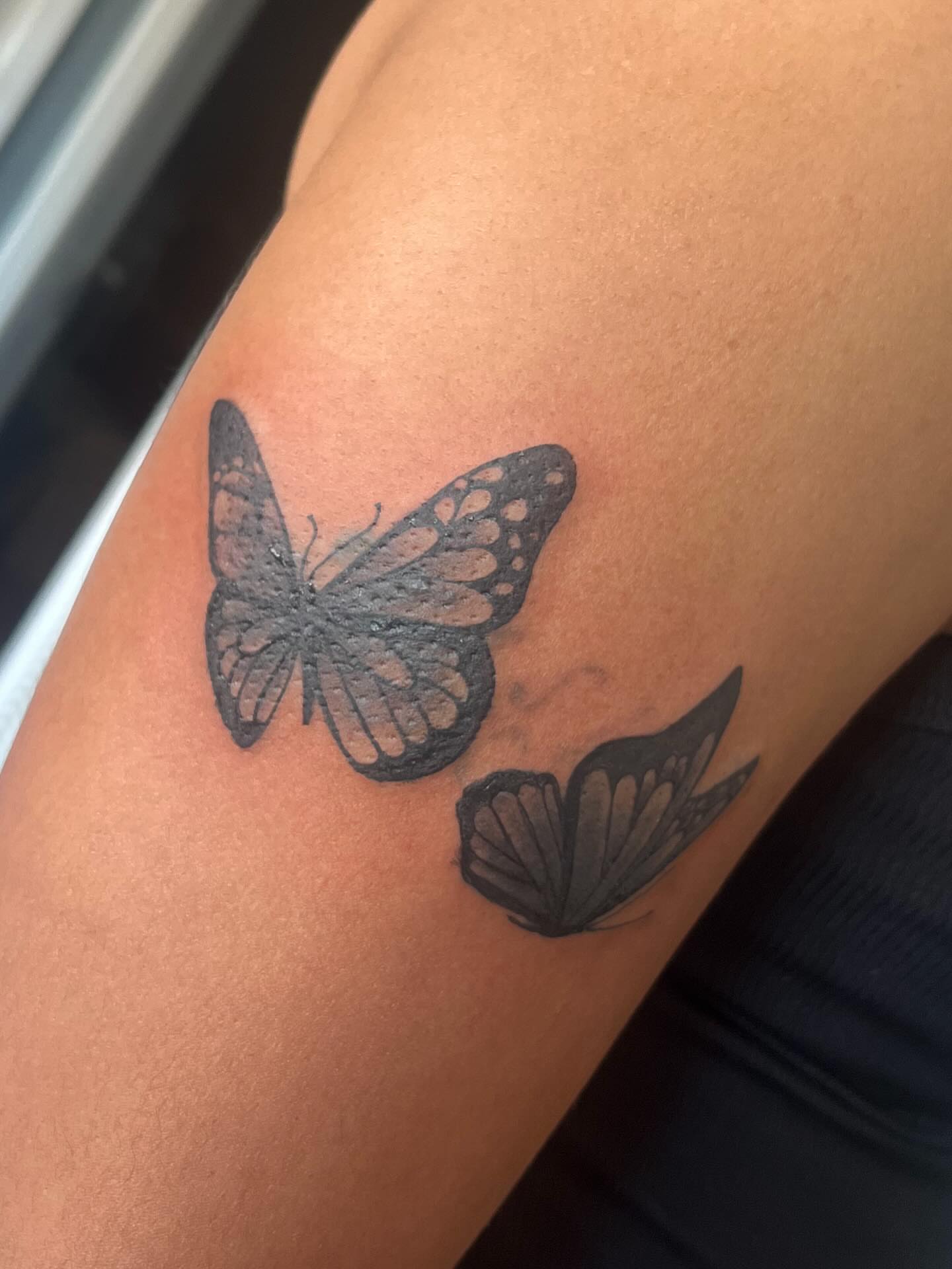 Butterfly black and grey tattoo on the forearm by Bris