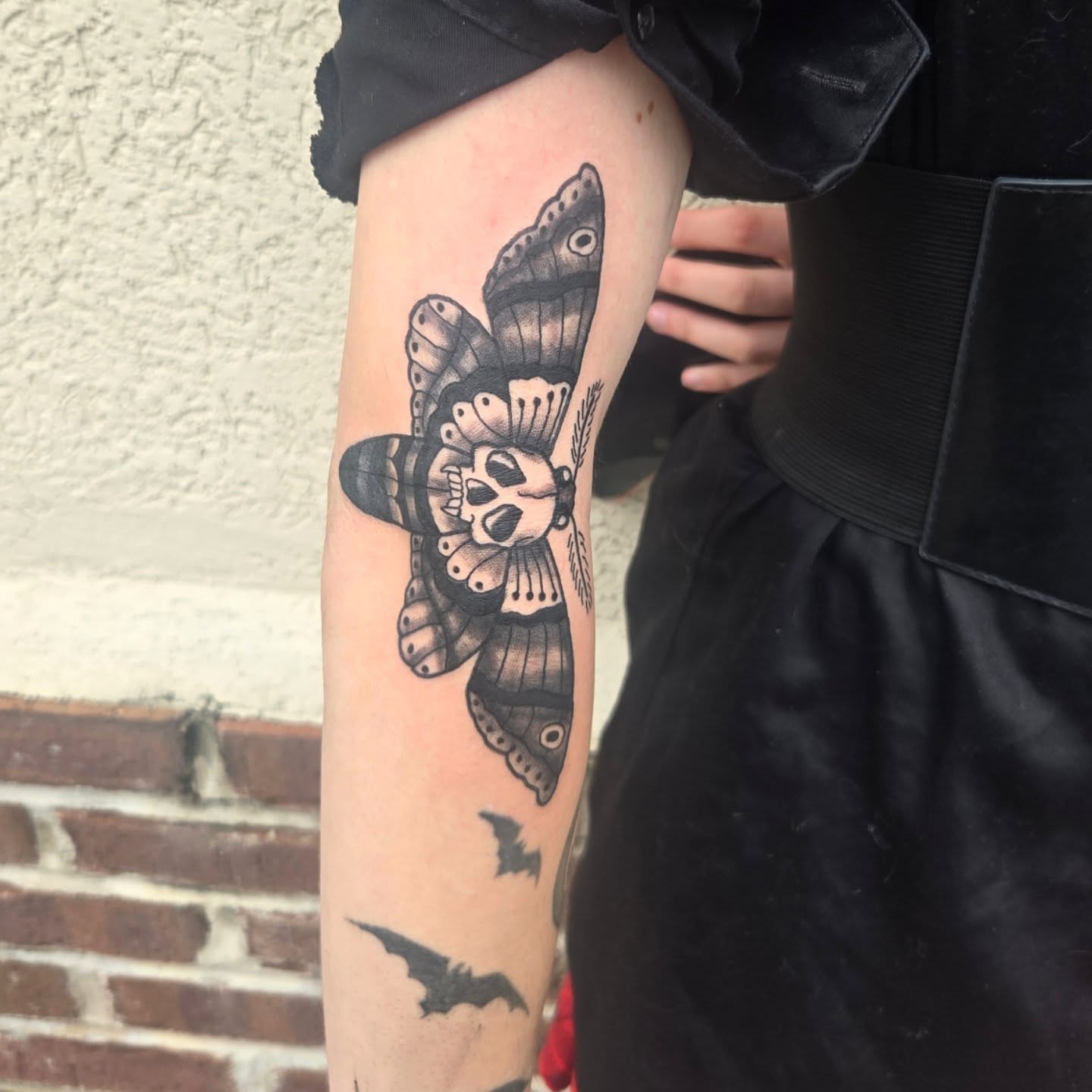 Moth with skull black and grey tattoo on the forearm by Abigail (Bgail) Boyd