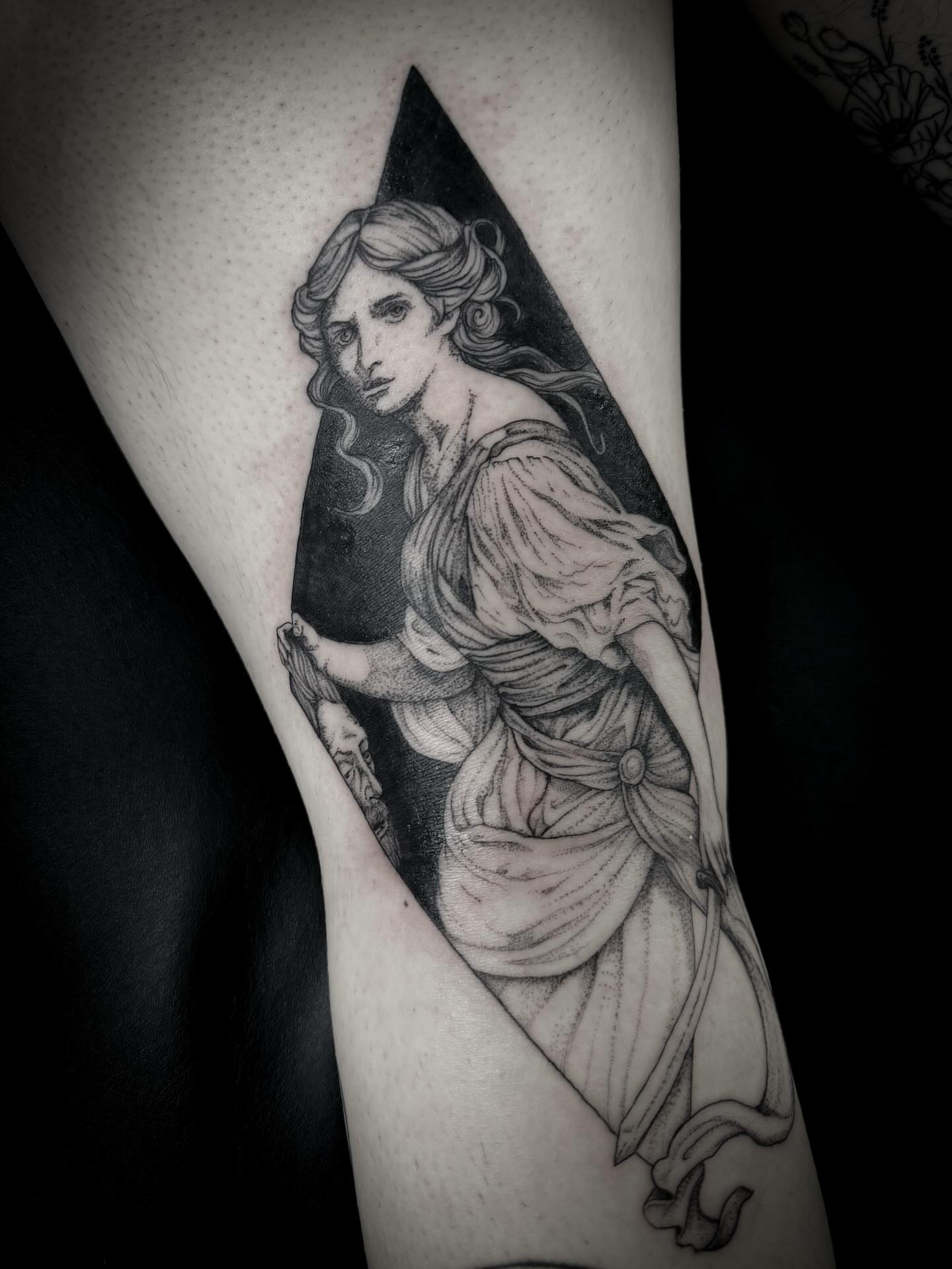 Statue of woman black and grey tattoo on the forearm by Christen Wolfe CA Tattooer