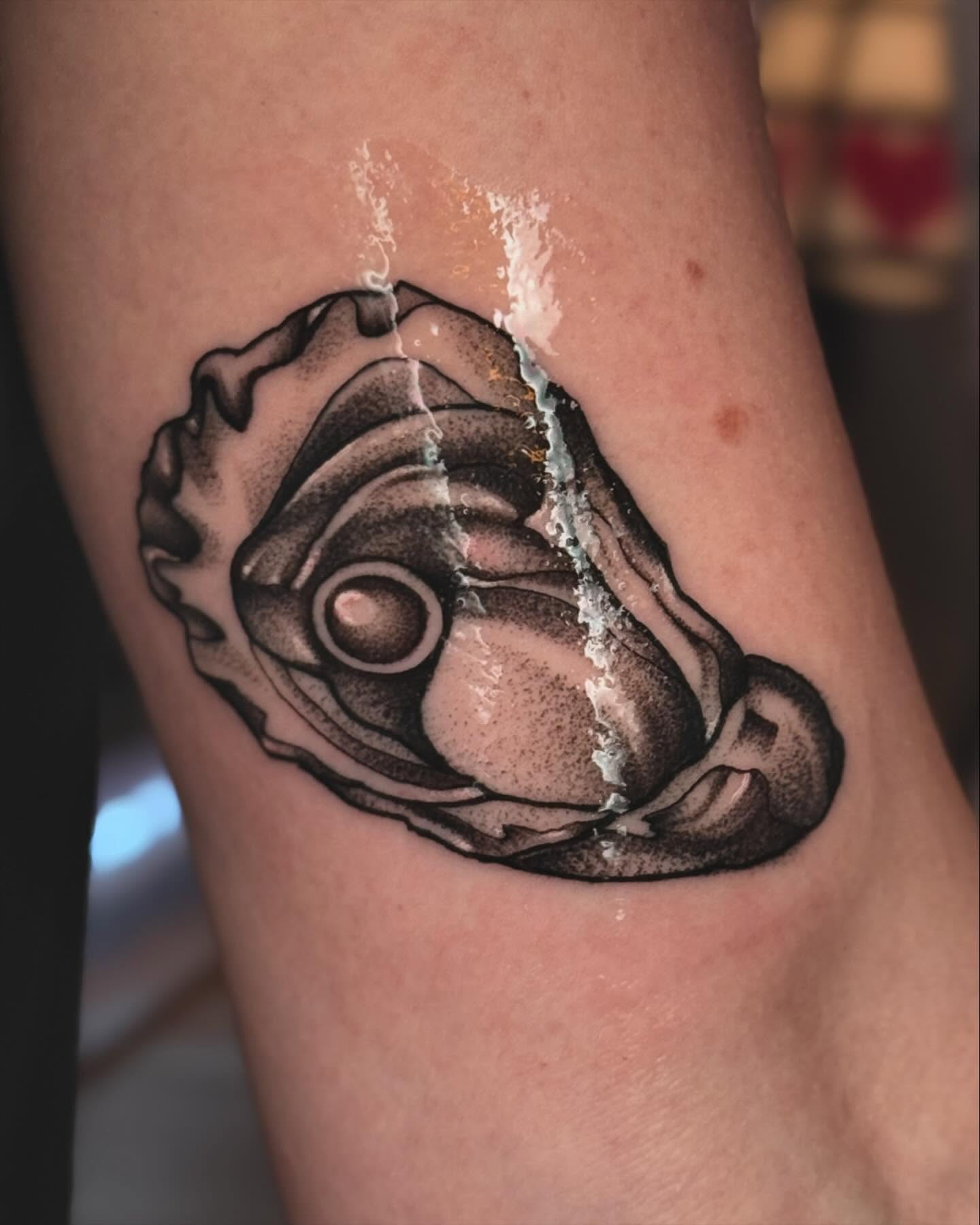 Alien head dotwork tattoo on the forearm by laura baldwin