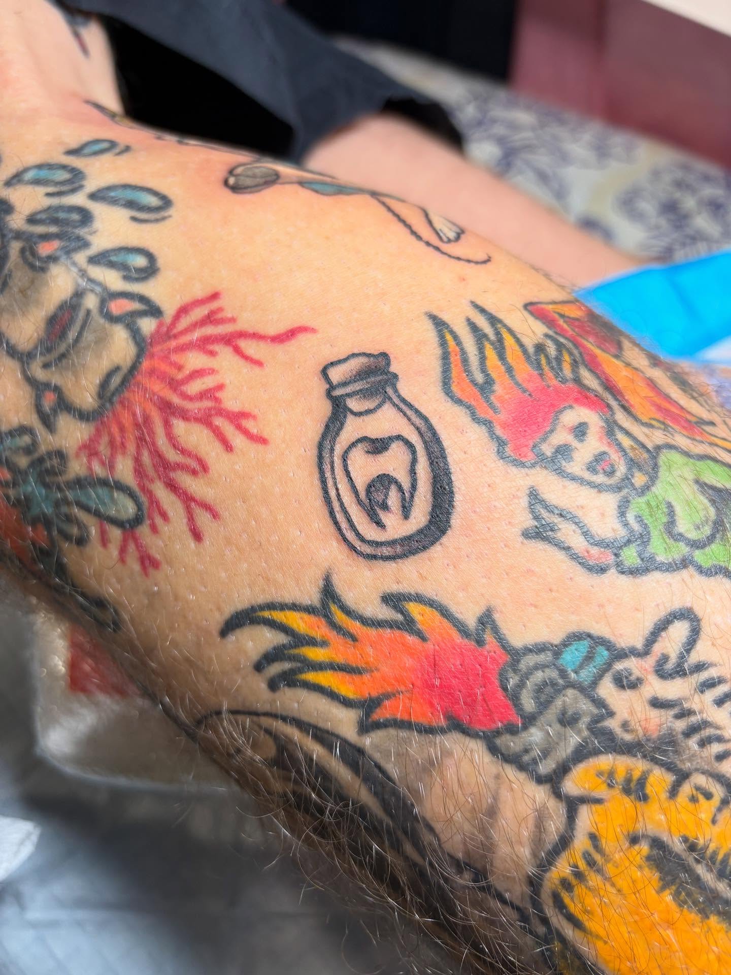 Tooth in bottle American traditional tattoo on the forearm by gia❤️‍🔥🎲, Maryville, Tennessee