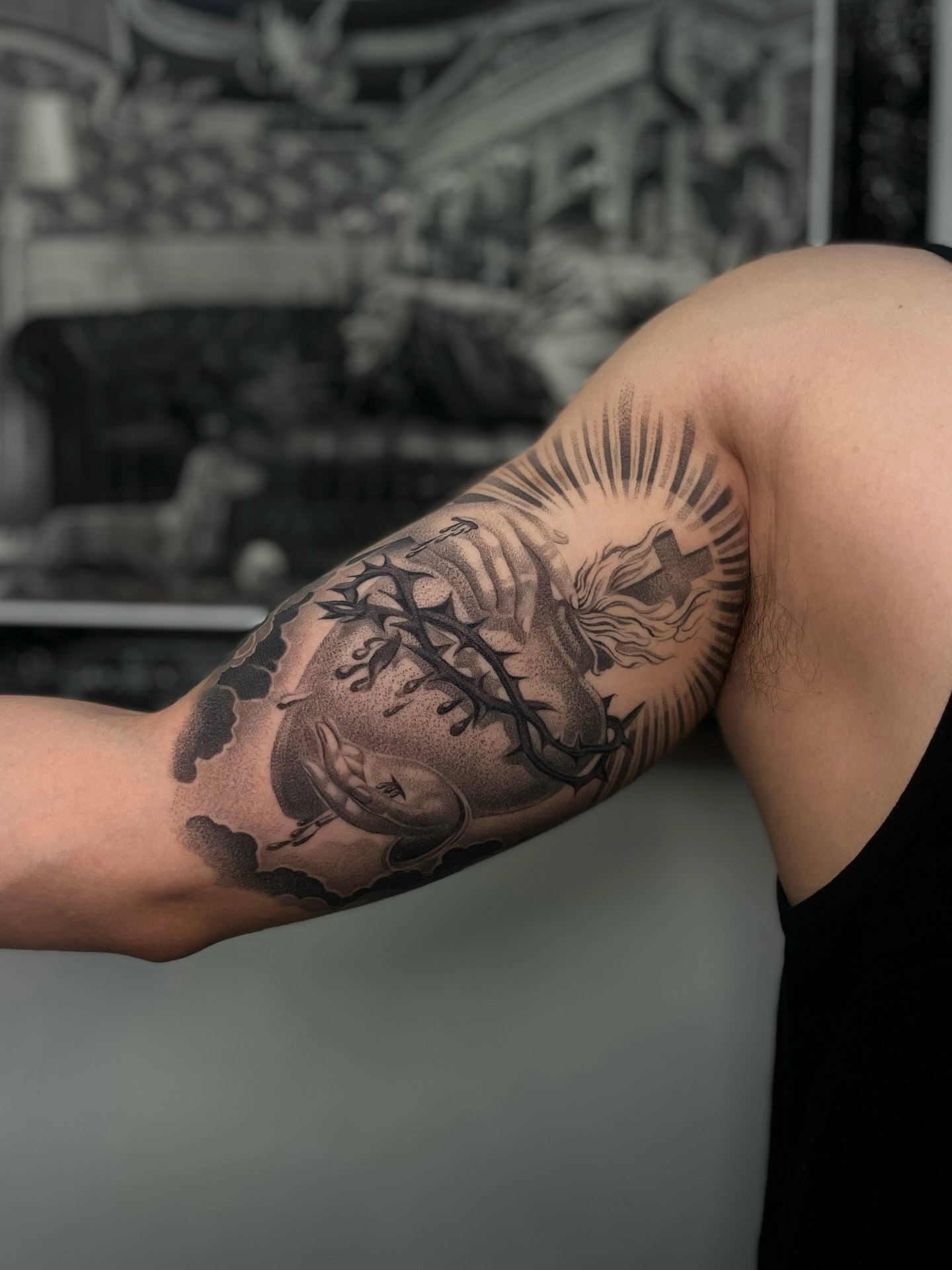 Heart with cross realism tattoo on the forearm by Vanessa Valdivia
