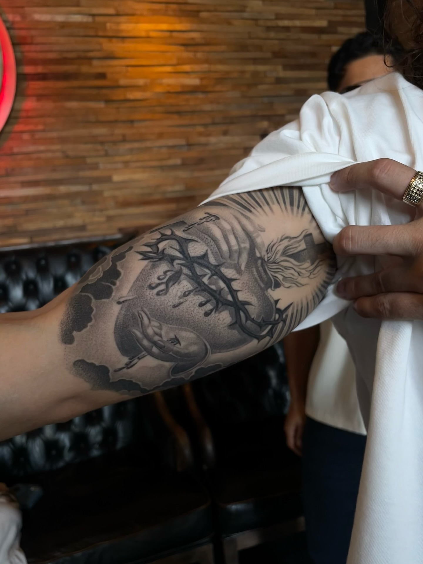 Dragon and clouds black and grey tattoo on the forearm by Vanessa Valdivia