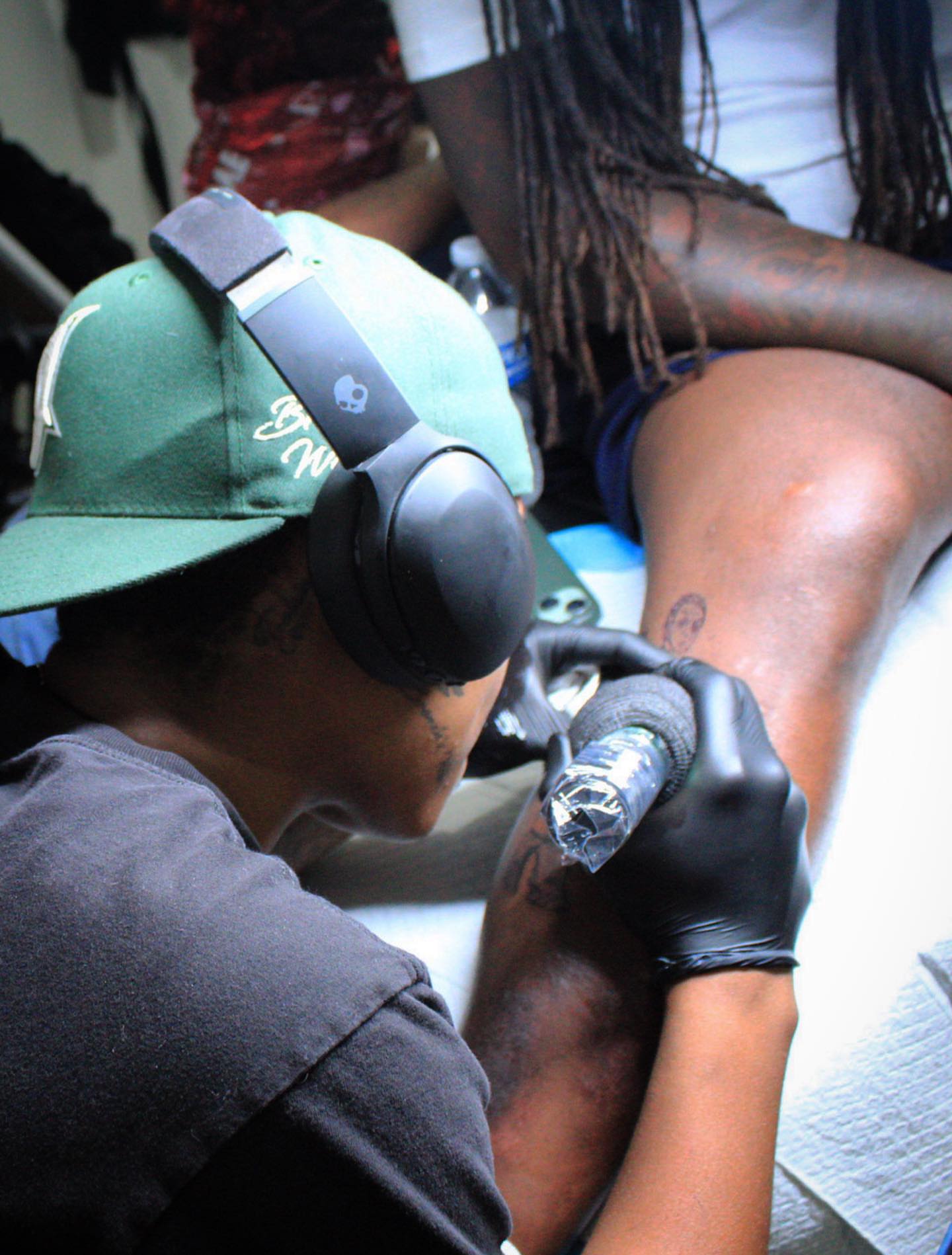 Leg tattoo black and grey tattoo on the leg by Traveling Tattoo Artist π