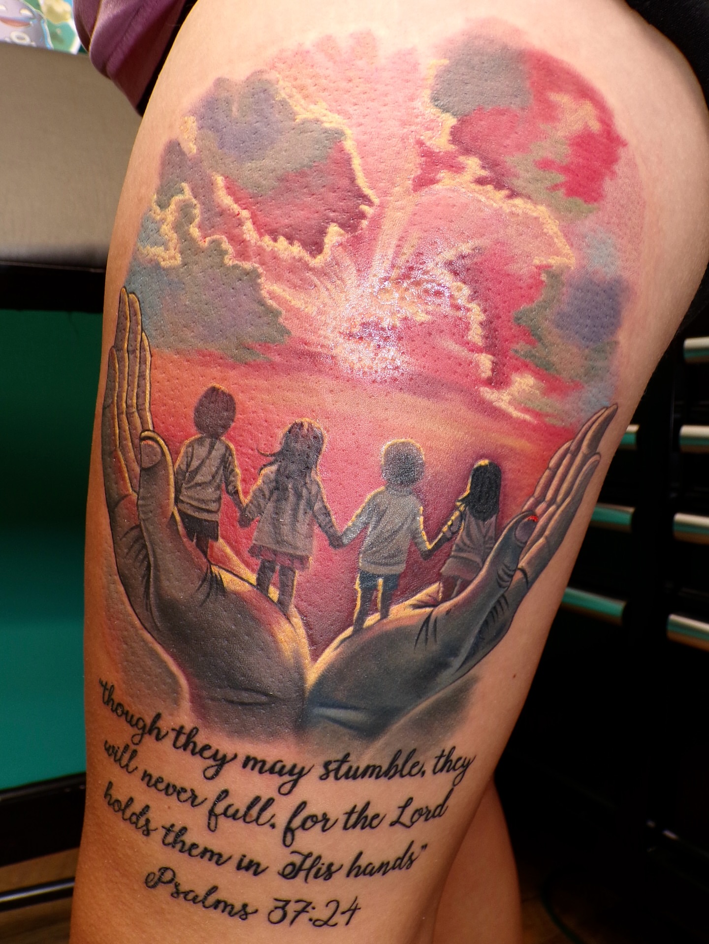 Children held by hands realism tattoo on the thigh by ✥ Daemon Downing ✥ Kansas Tattoo Artist ✥, Wichita, Kansas
