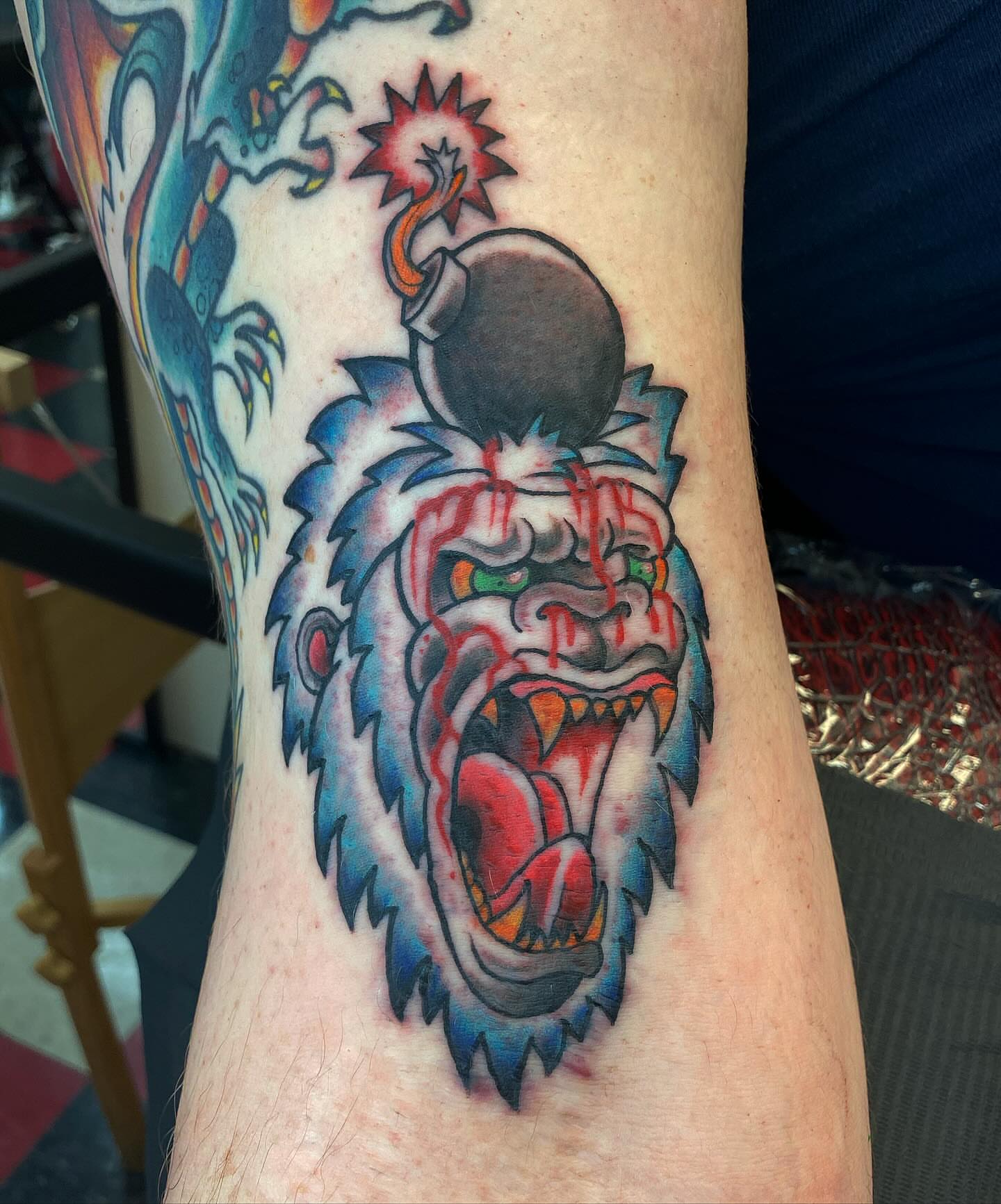 Gorilla with bomb American traditional tattoo on the forearm by Jonah