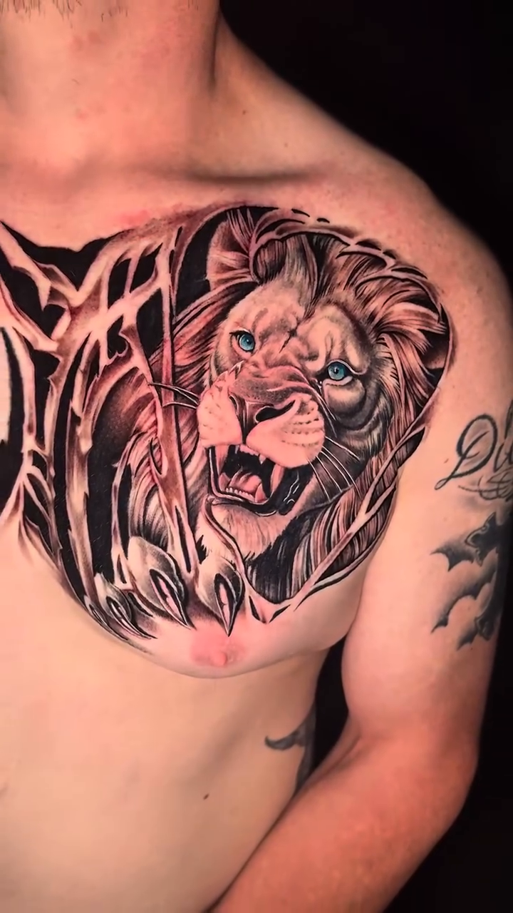 Lion head realism tattoo by Travis Sleeper