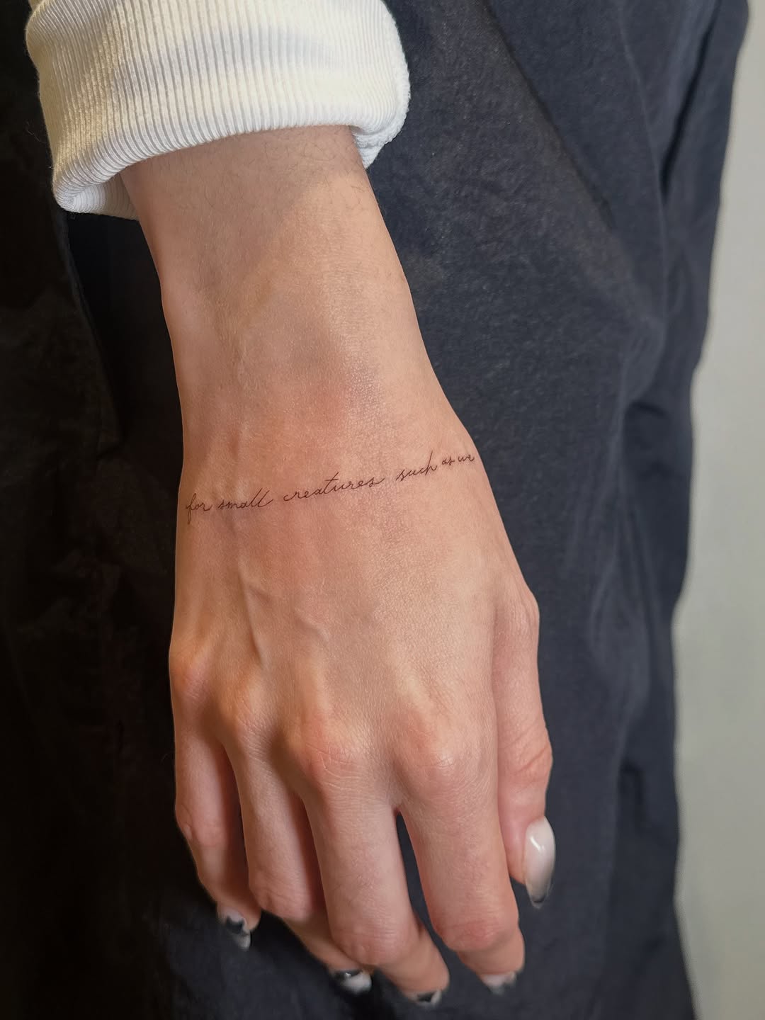 Script lettering lettering tattoo on the forearm by @taravychi