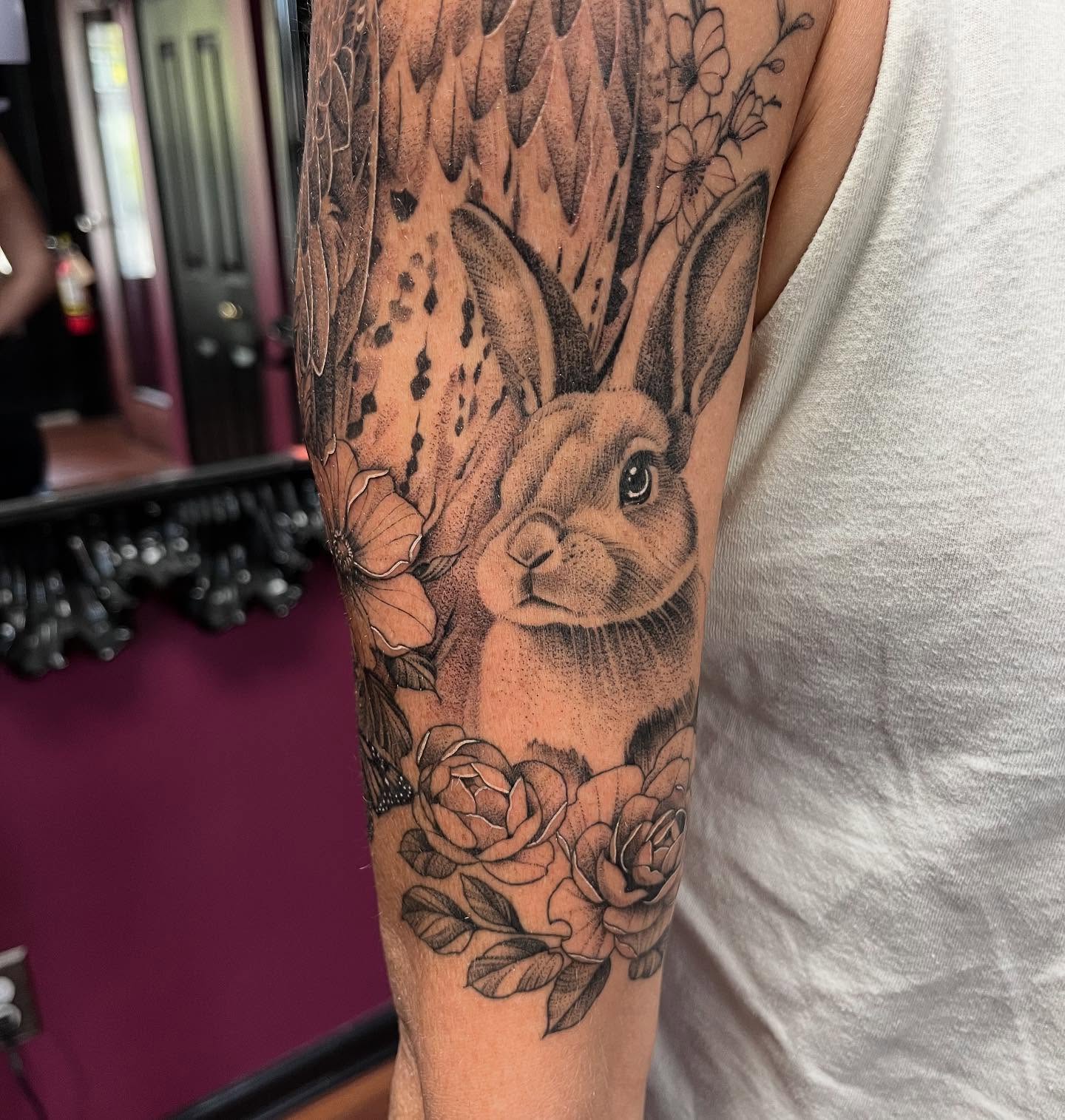 Rabbit and flowers dotwork tattoo on the forearm by Kelli Donegan ๐ท