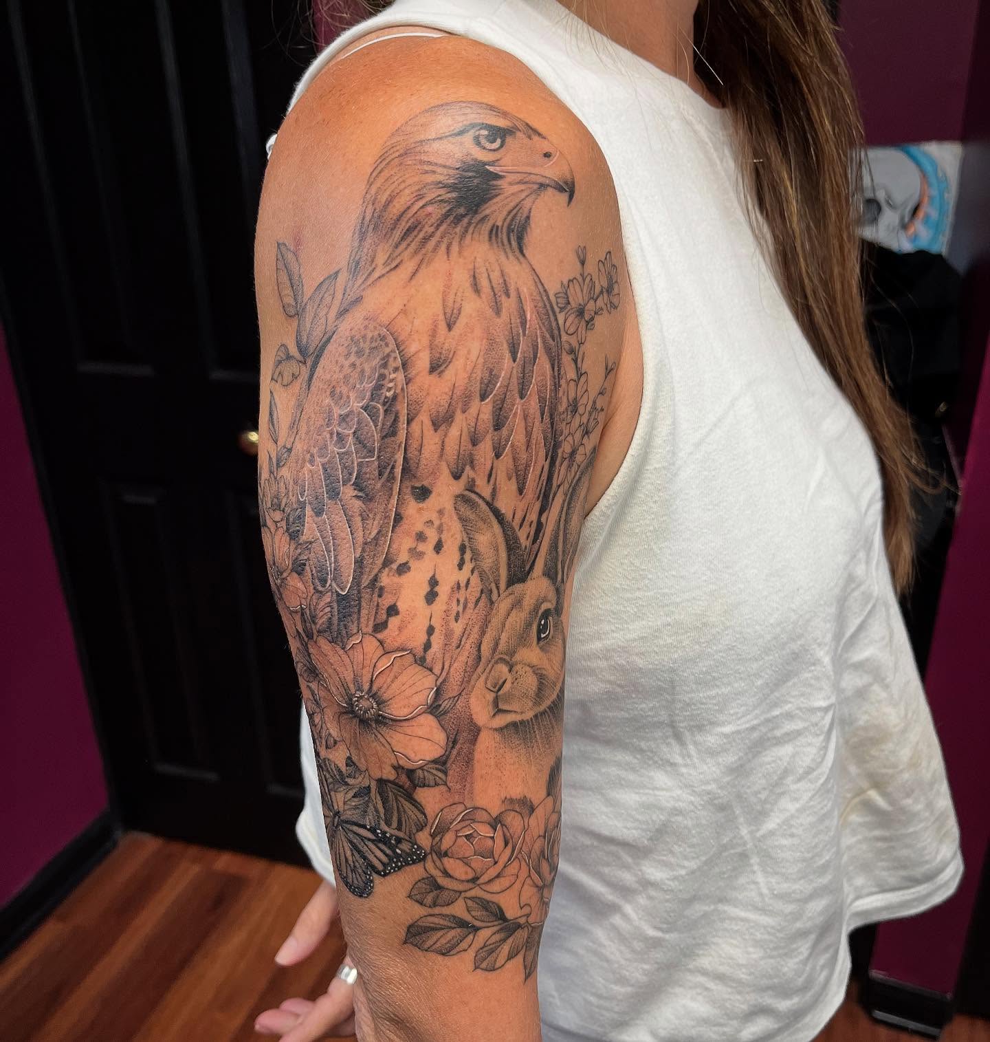 Hawk and rabbit realism tattoo on the upper arm by Kelli Donegan ๐ท
