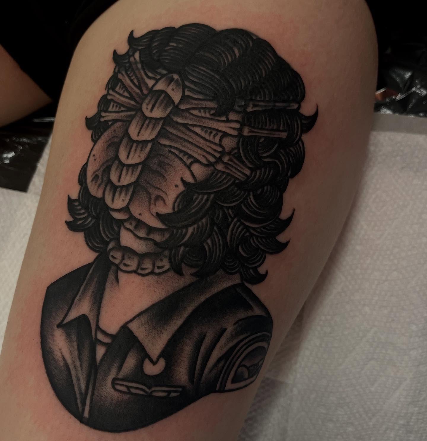 Man with mustache black and grey tattoo on the thigh by Lee Brewster, Erlanger, Kentucky