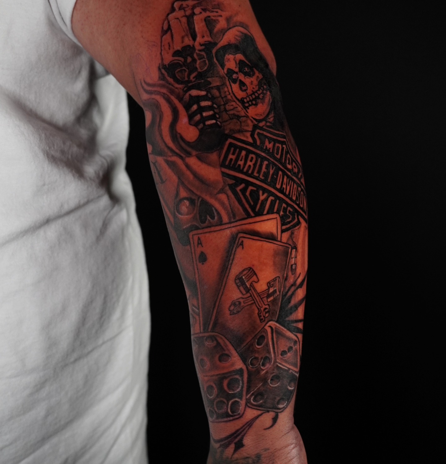 Motorcycle-themed tattoo black and grey tattoo on the forearm by @tattoobytats