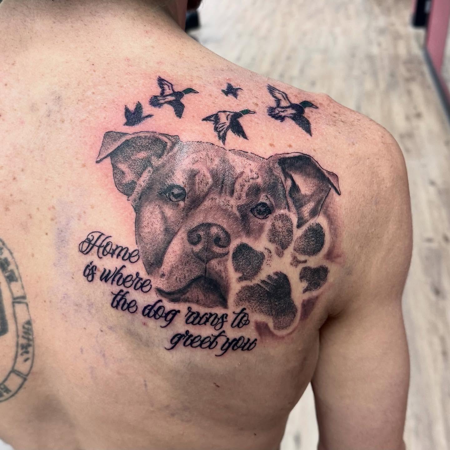 Dog and quote realism tattoo on the shoulder by Robbie Bryant