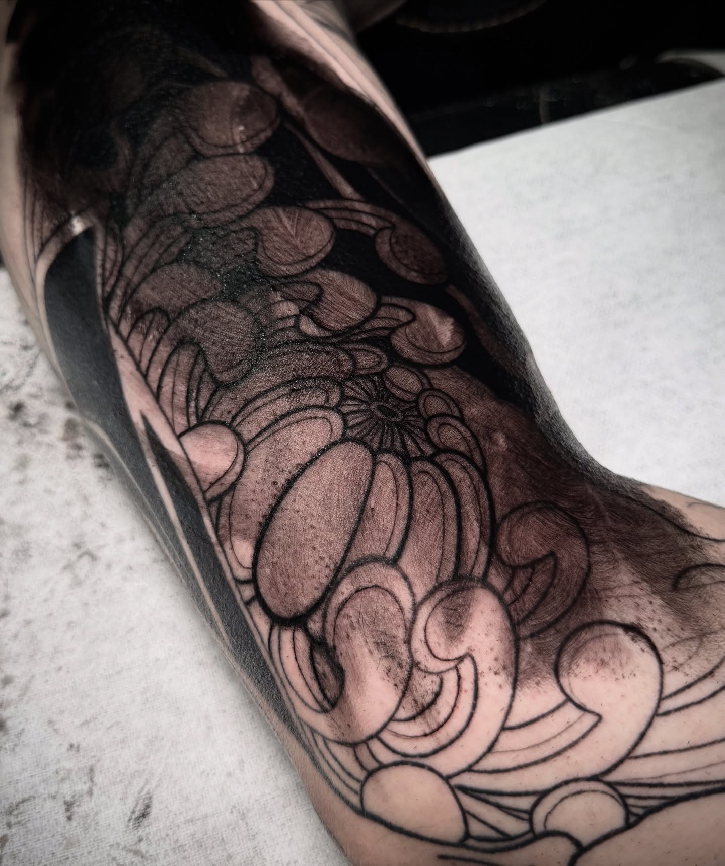 Chrysanthemum black and grey tattoo on the forearm by Stiven Gomez