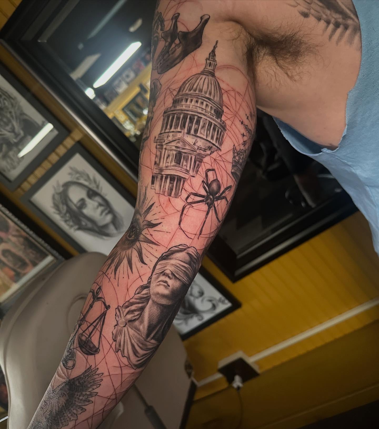 Statue of justice realism tattoo on the forearm by Comfy Chris Fettig