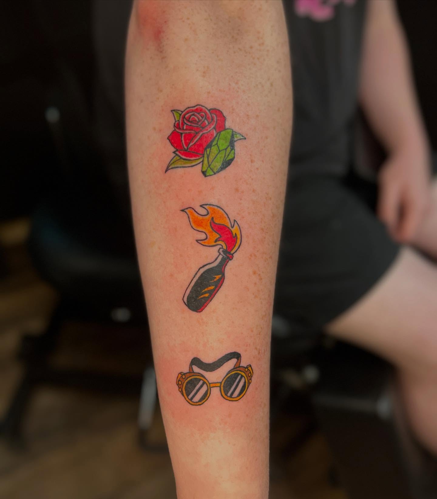 Rose, lighter, glasses American traditional tattoo on the forearm by Abby Camacho - Tattoo Artist and Piercer โจ๐