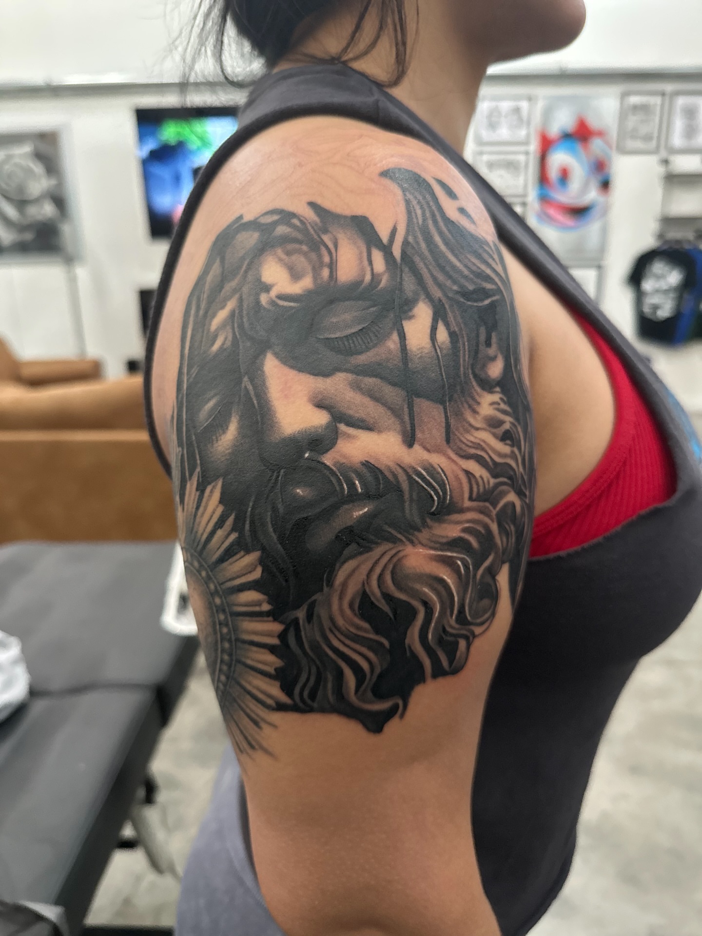 Bearded man realism tattoo on the shoulder by Travis
