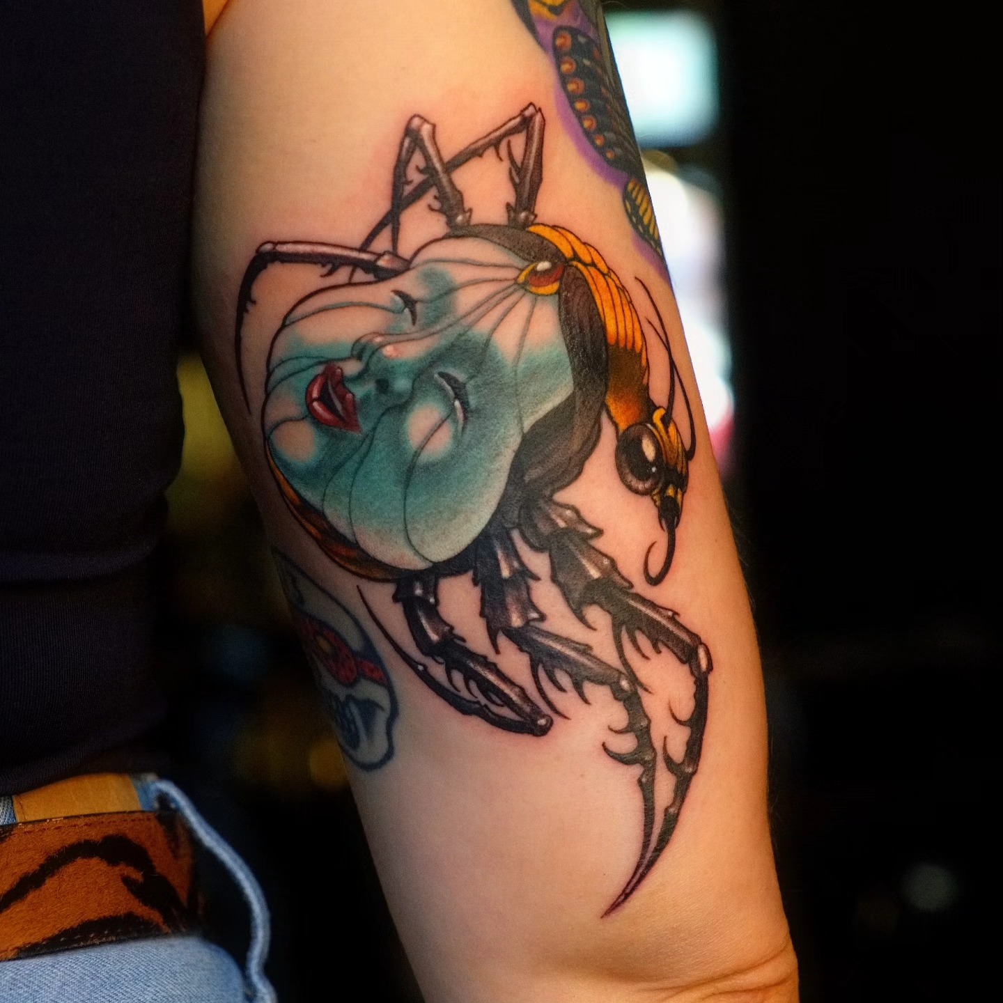 Insect and woman American traditional tattoo on the forearm by Justin Byrd, Kansas City, Missouri