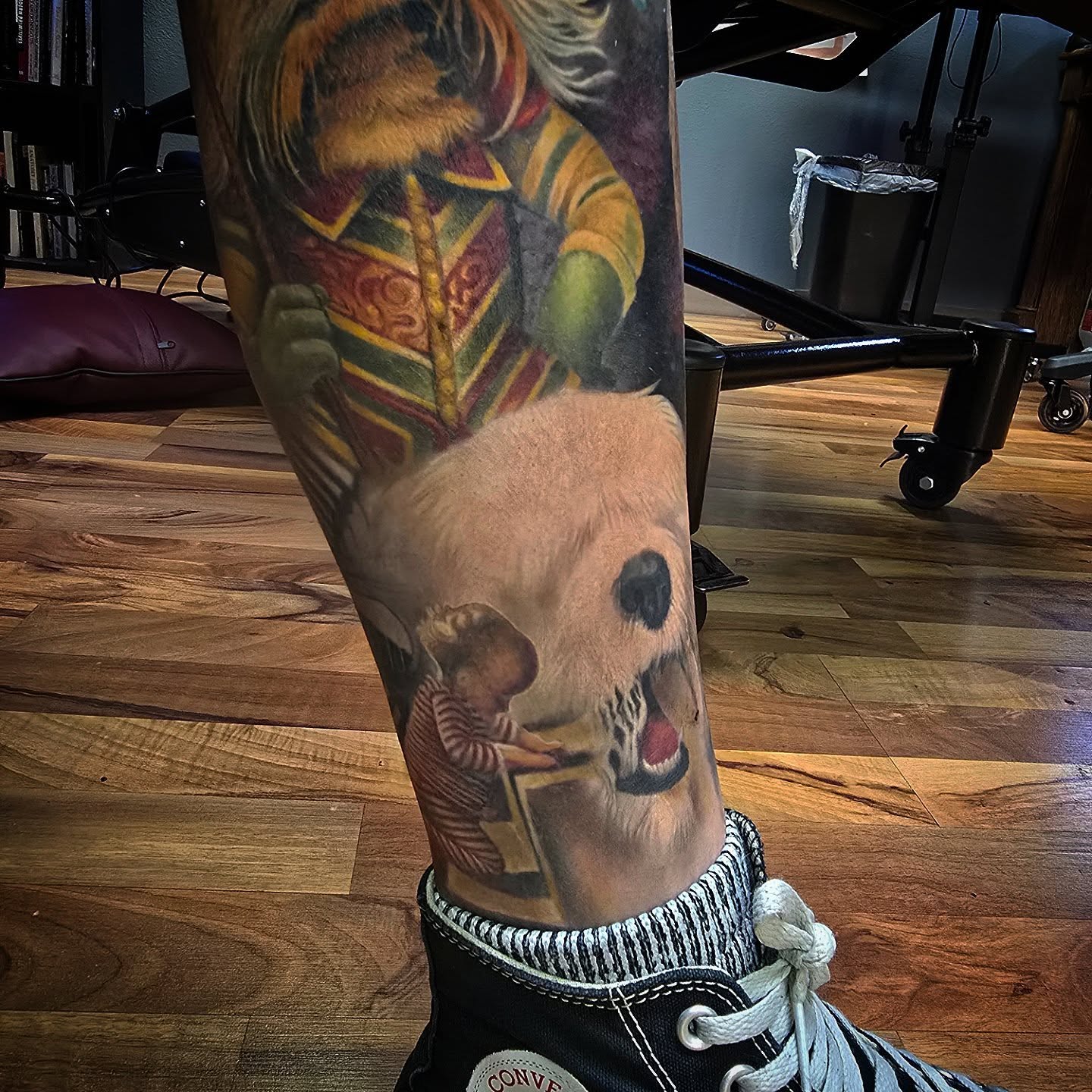 Jester and child realism tattoo on the forearm by Alexander L. Wolff, Rapid City, South Dakota