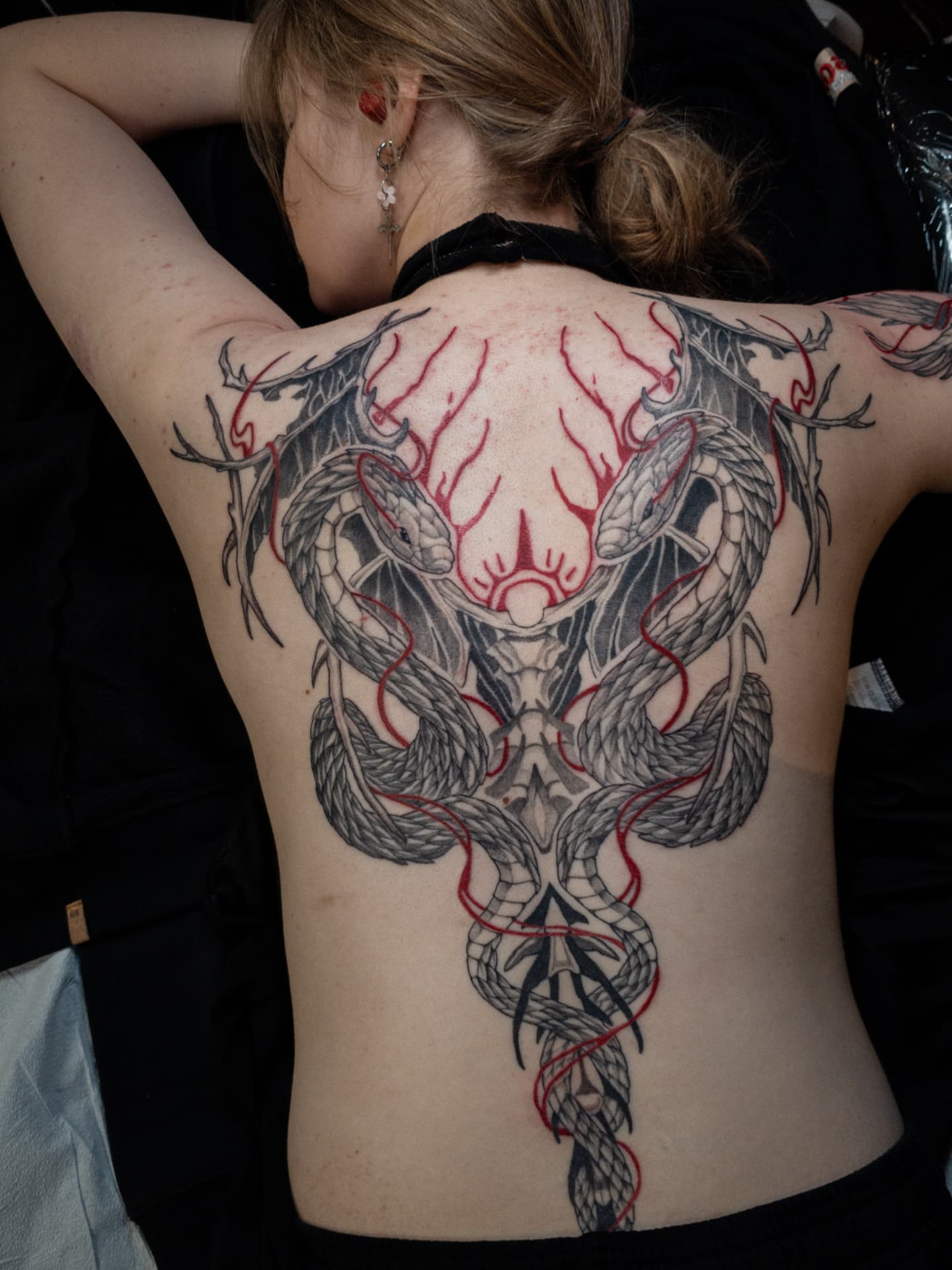 Dragon realism tattoo on the back by EyeSee Tattoos