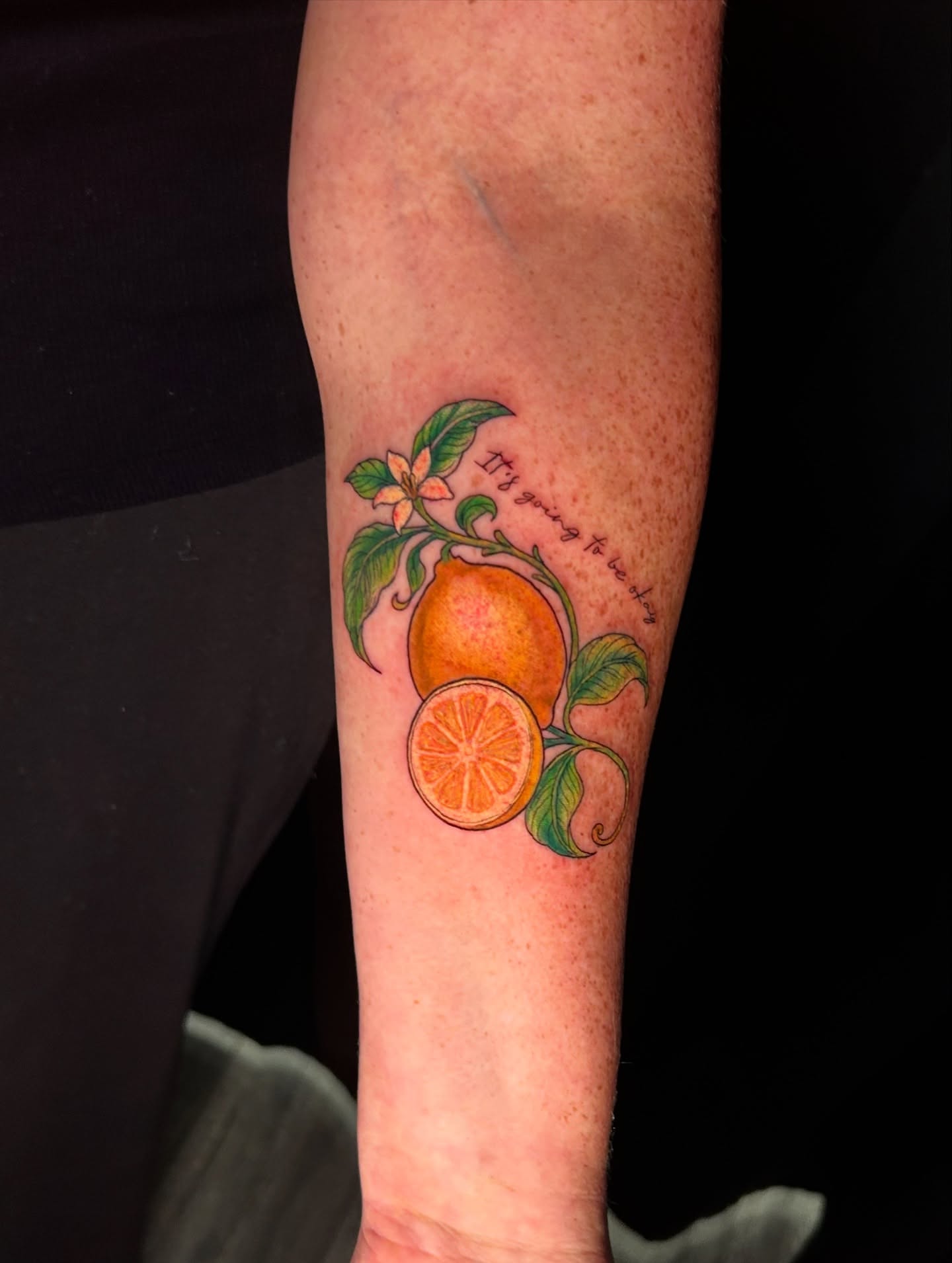 Orange fruit realism tattoo on the forearm by Brittany Brutal