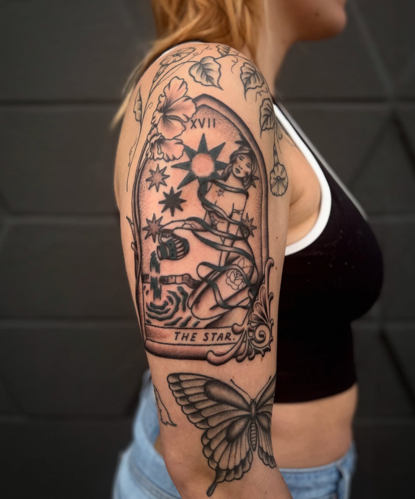 The star tarot card American traditional tattoo on the upper arm by Mazie