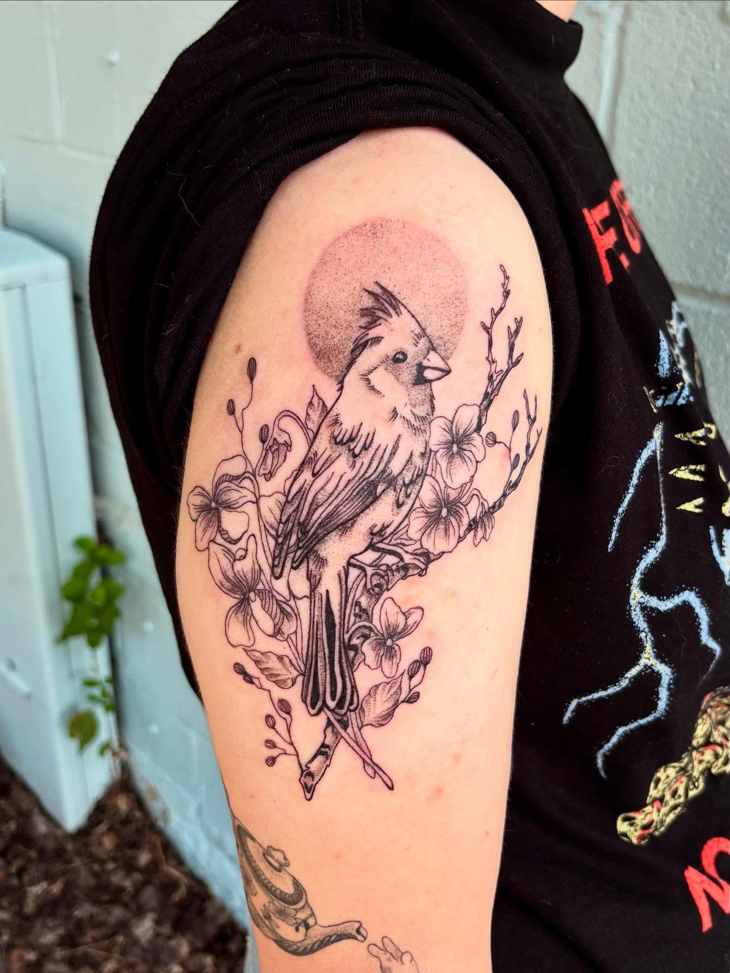 Bird and flowers black and grey tattoo on the shoulder by Ashley Ellerman