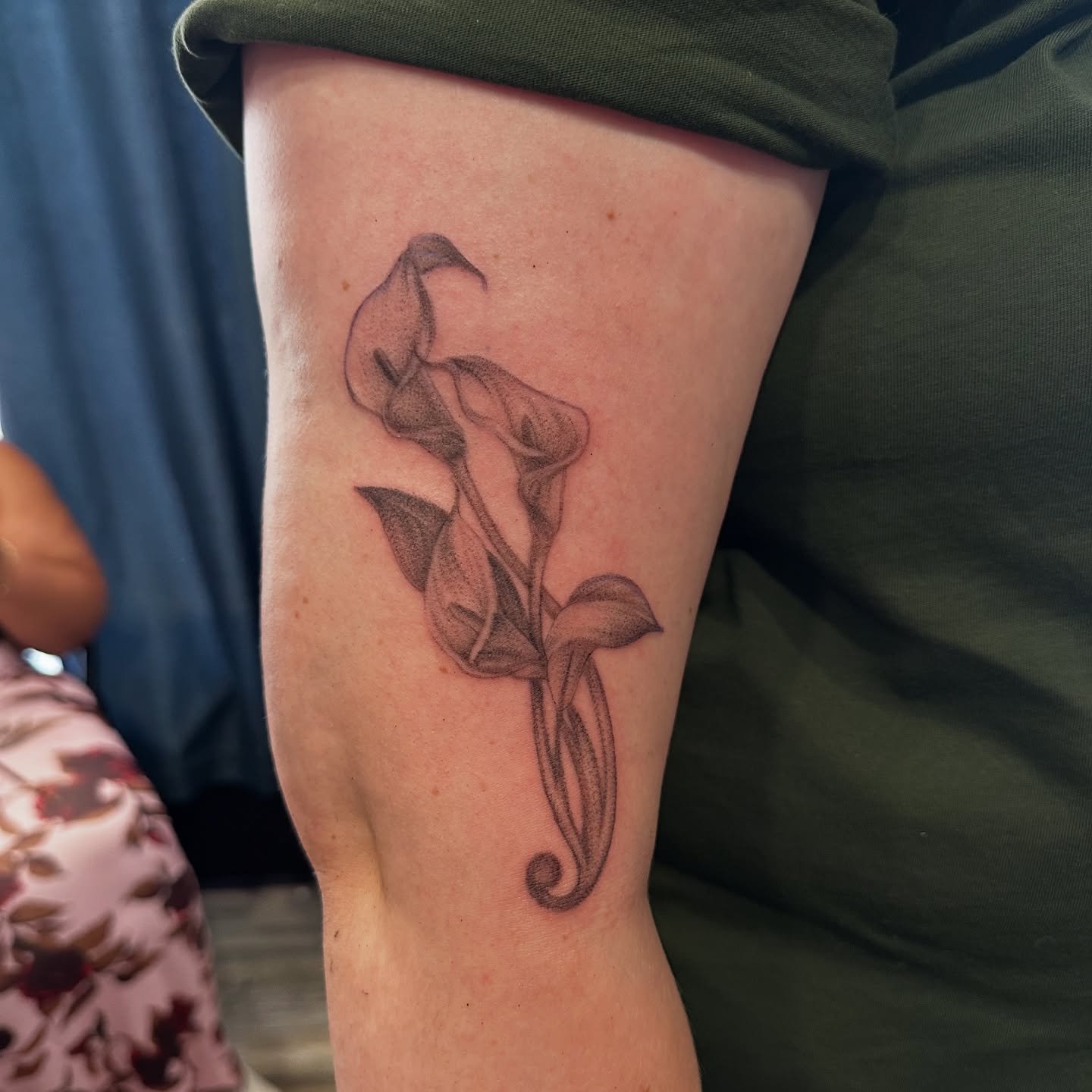 Calla lily black and grey tattoo on the forearm by Mia Layne 🤎