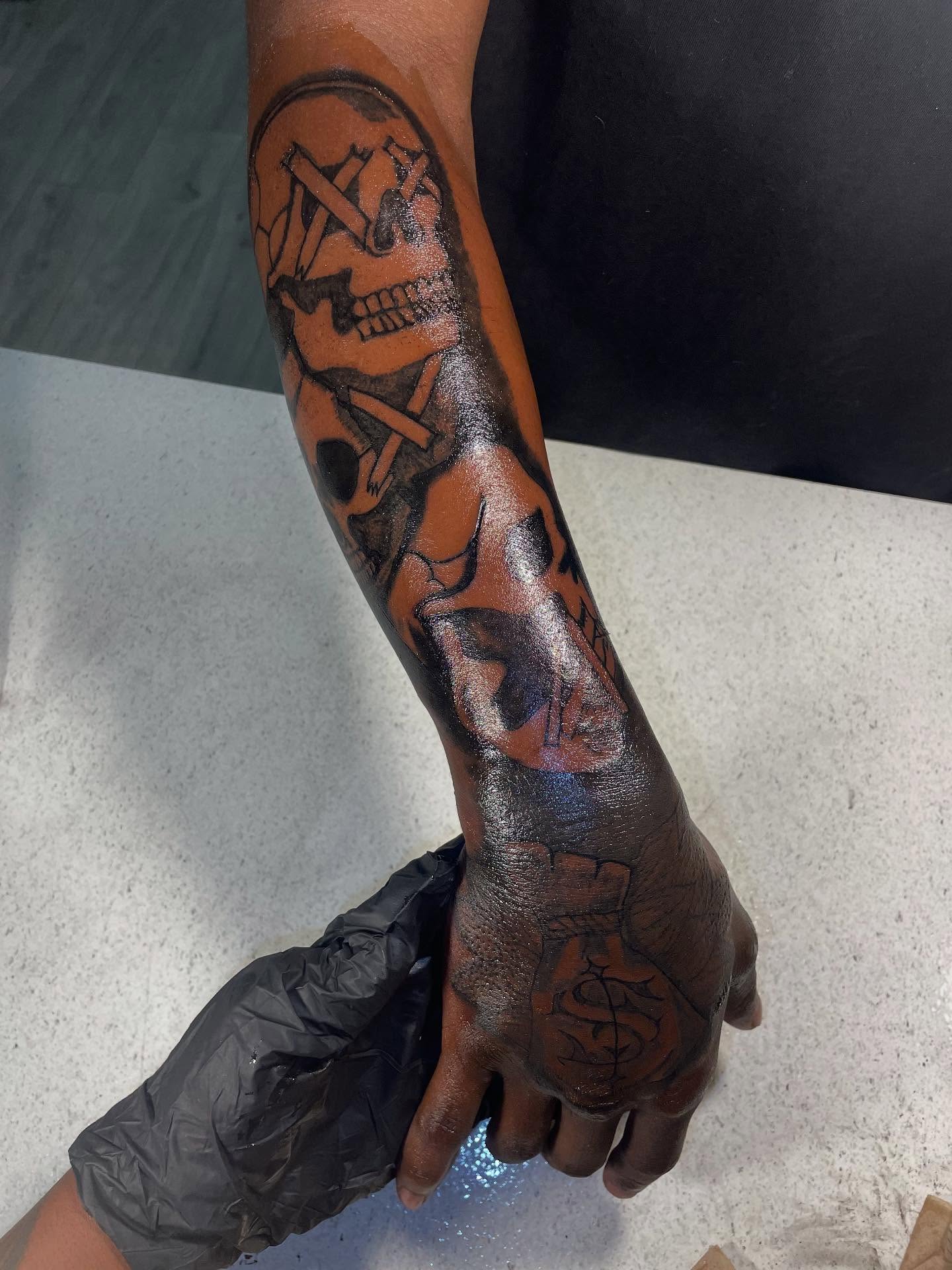 Skull and crossbones American traditional tattoo on the forearm by Dm To Book ๐, Charlotte, North Carolina