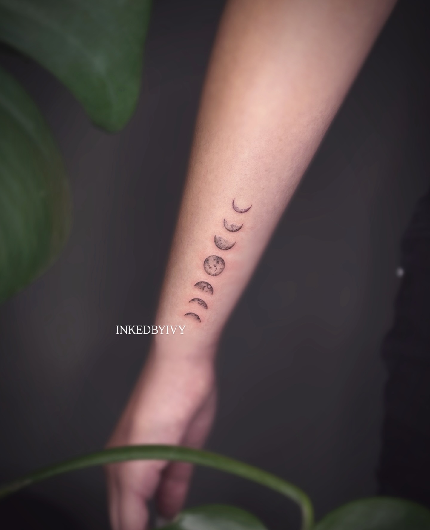 Moon phases dotwork tattoo on the forearm by IVY