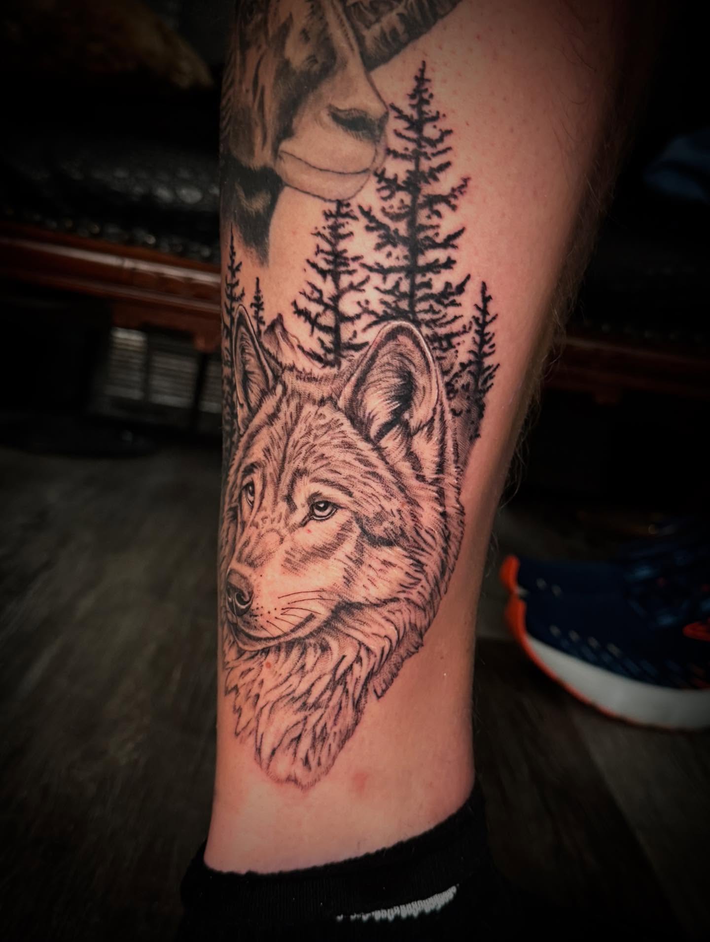 Wolf realism tattoo on the forearm by Leslea Hipp