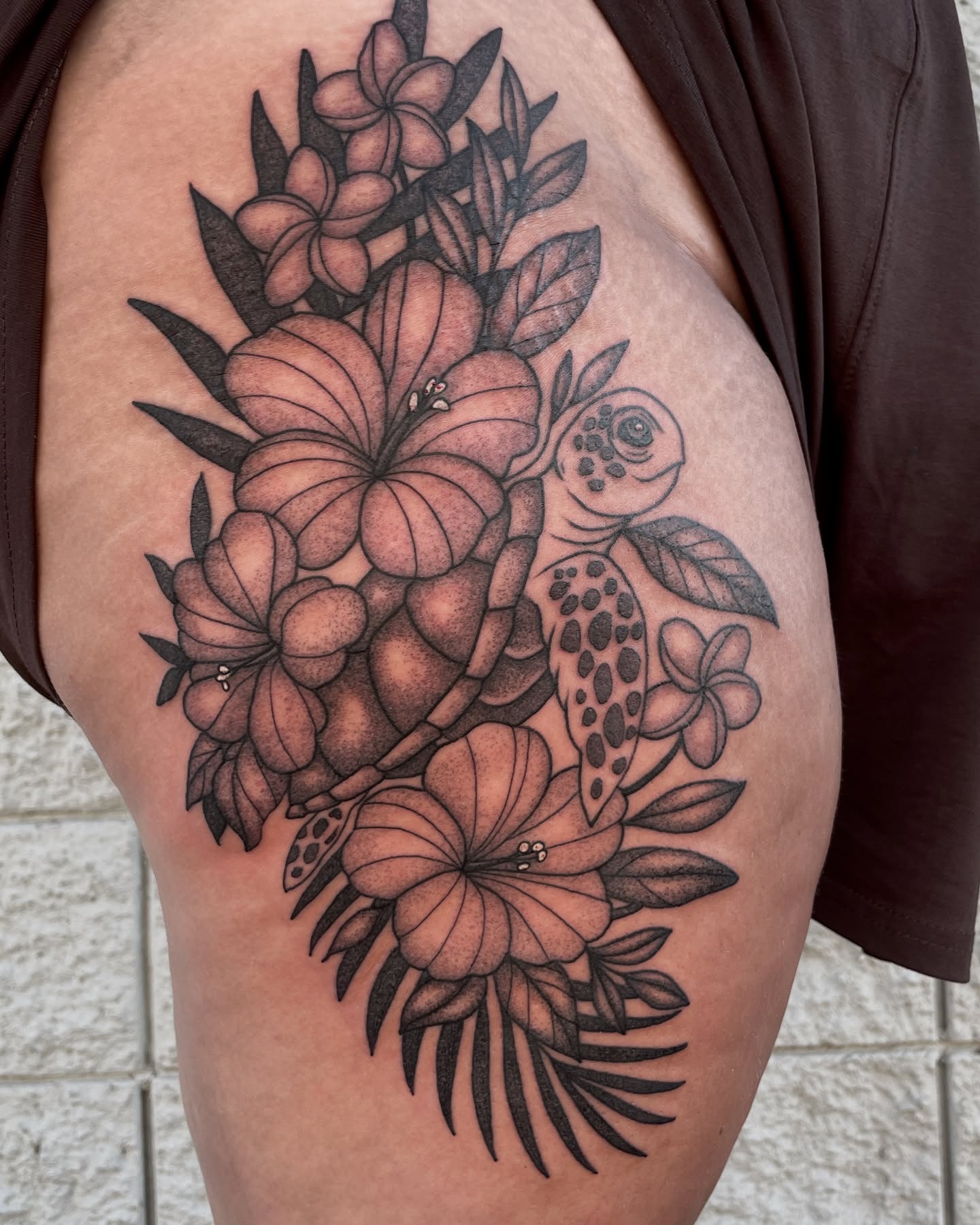 Sea turtle and tropical flowers realism tattoo on the thigh by Austin Clark