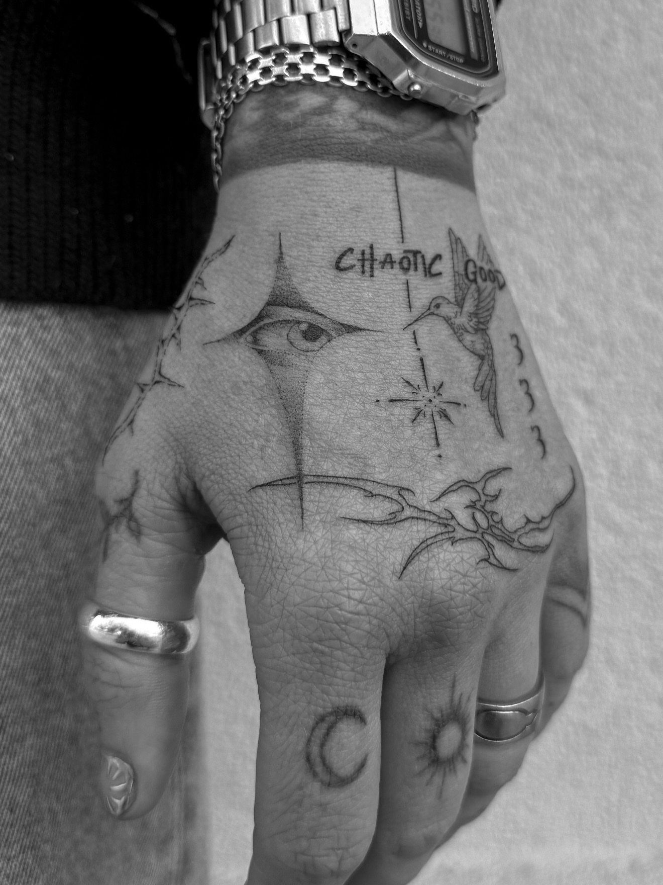 Eye and hummingbird black and grey tattoo on the hand by Abby Robinson
