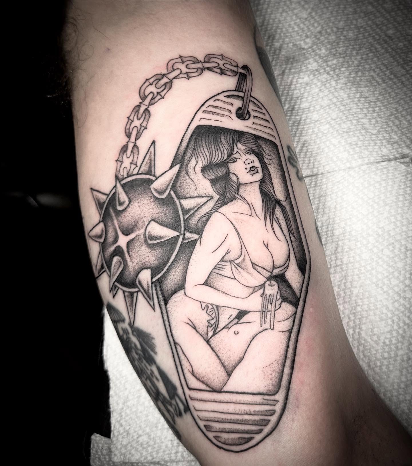 Woman in cage realism tattoo on the forearm by Lia Massari