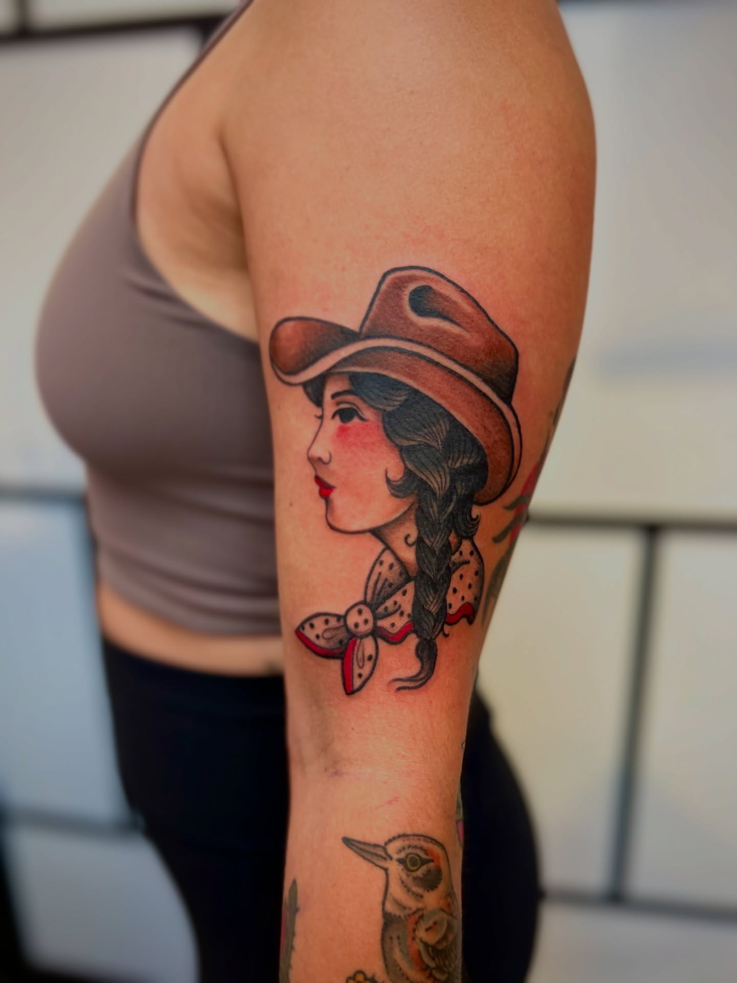 Cowgirl American traditional tattoo on the forearm by Ryan Willard, Denver, Colorado
