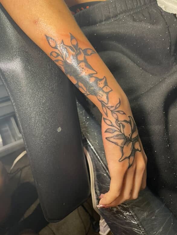 Flowers black and grey tattoo on the forearm by Dm To Book ๐, Charlotte, North Carolina