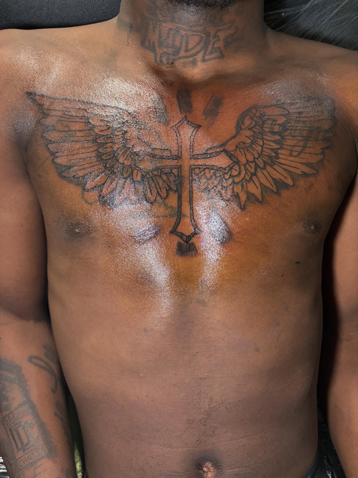 Cross with wings American traditional tattoo on the chest by Dm To Book ๐, Charlotte, North Carolina