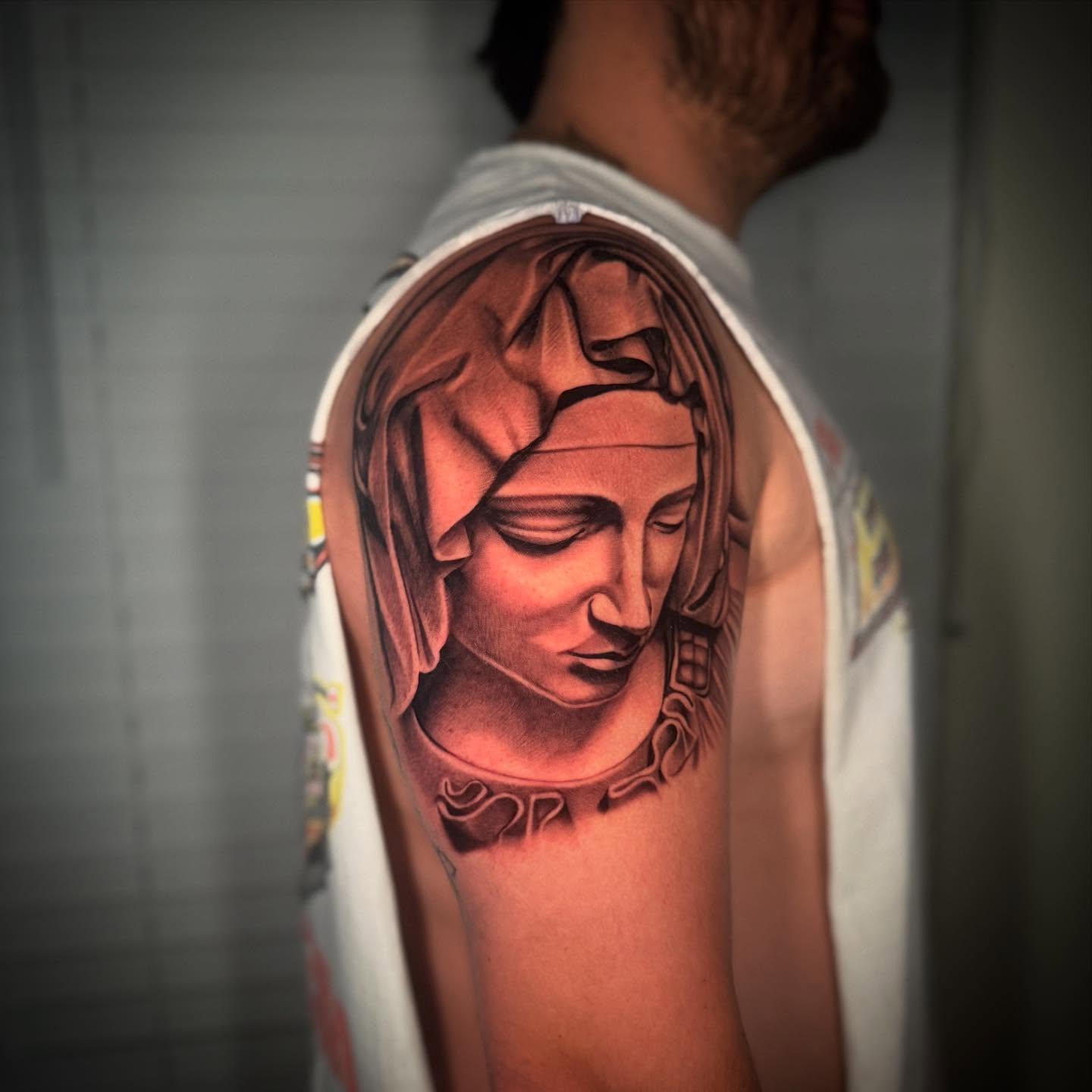 Woman's head realism tattoo on the shoulder by Geo