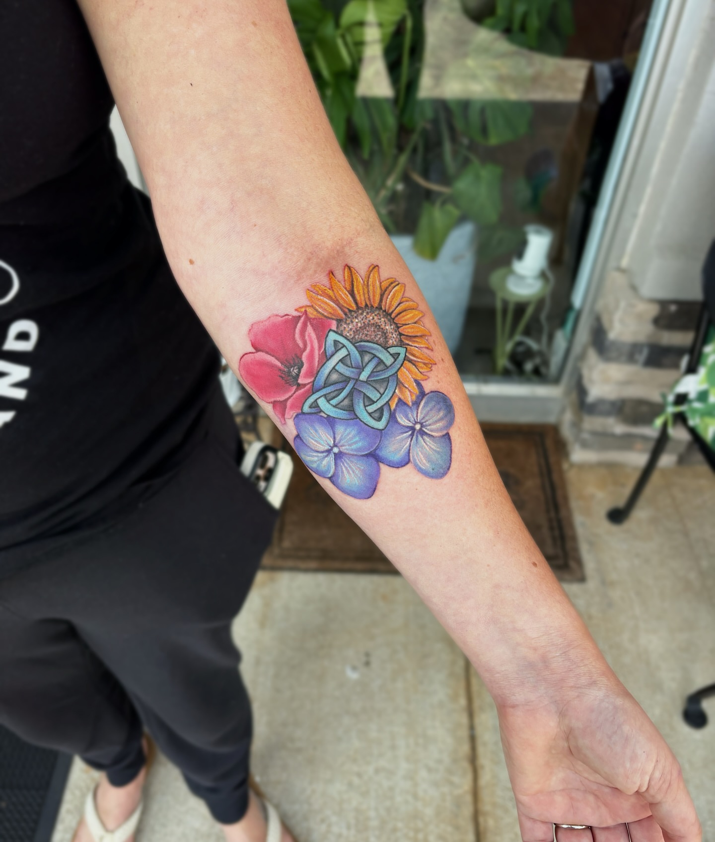 Flower arrangement dotwork tattoo on the forearm by Bunny Noel