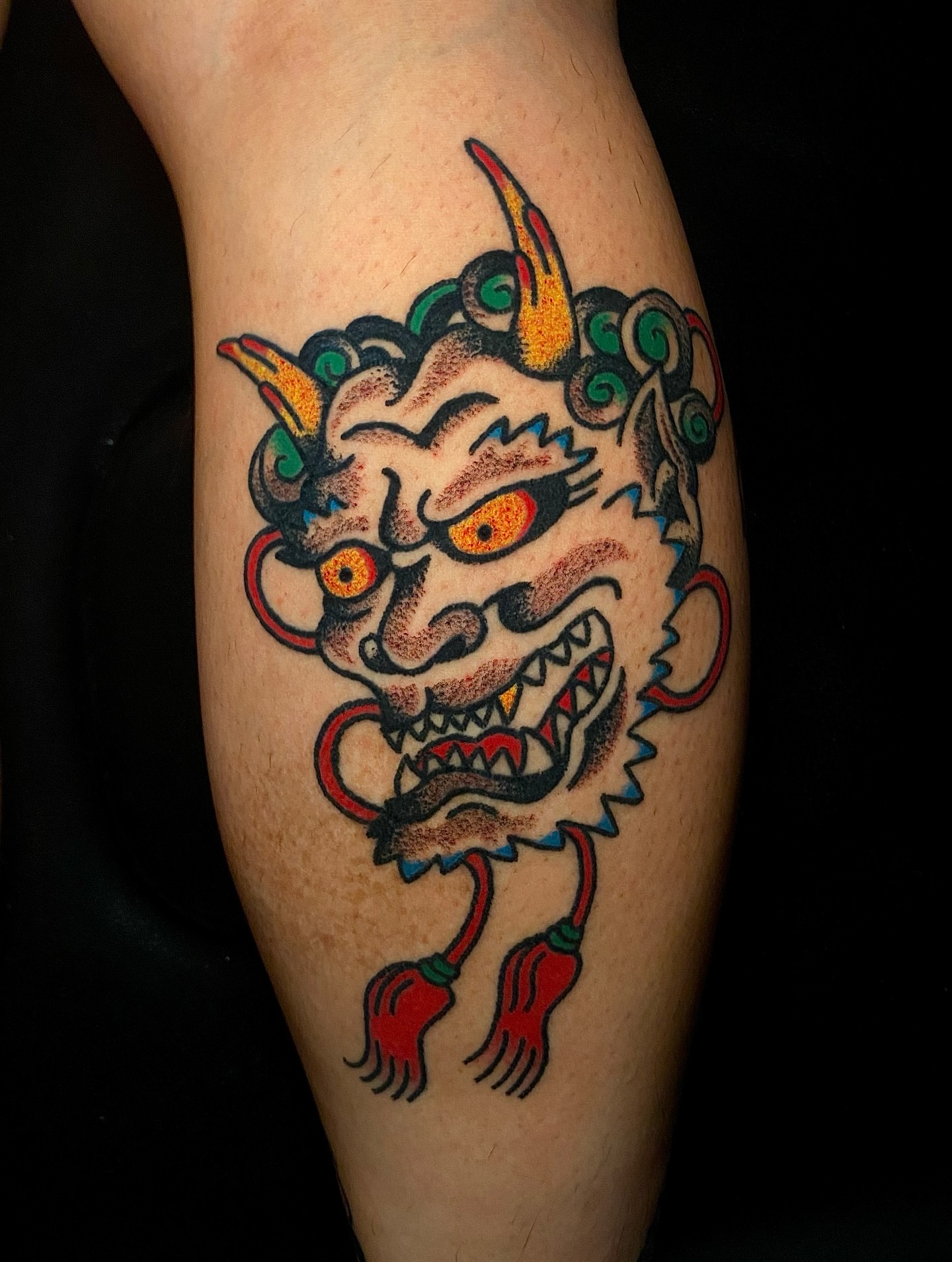 Demon head American traditional tattoo on the forearm by Daniel Diego