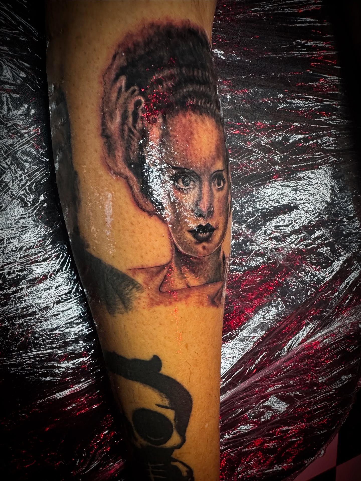 Woman's face realism tattoo on the forearm by Christa Martinez