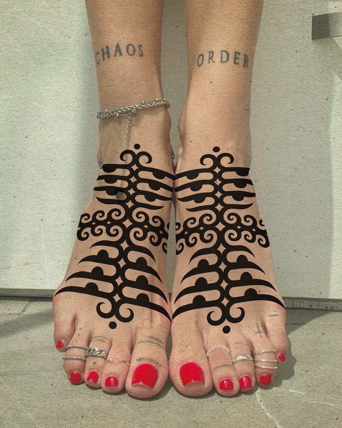 Scrollwork ornamental tattoo on the foot by Fisher Man