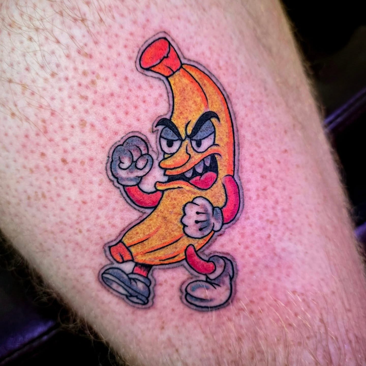 Banana character new school tattoo on the forearm by Michael Latendresse