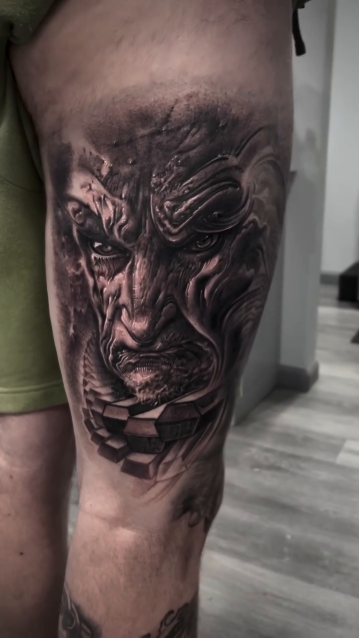 Grotesque face realism tattoo by Robert Hernandez