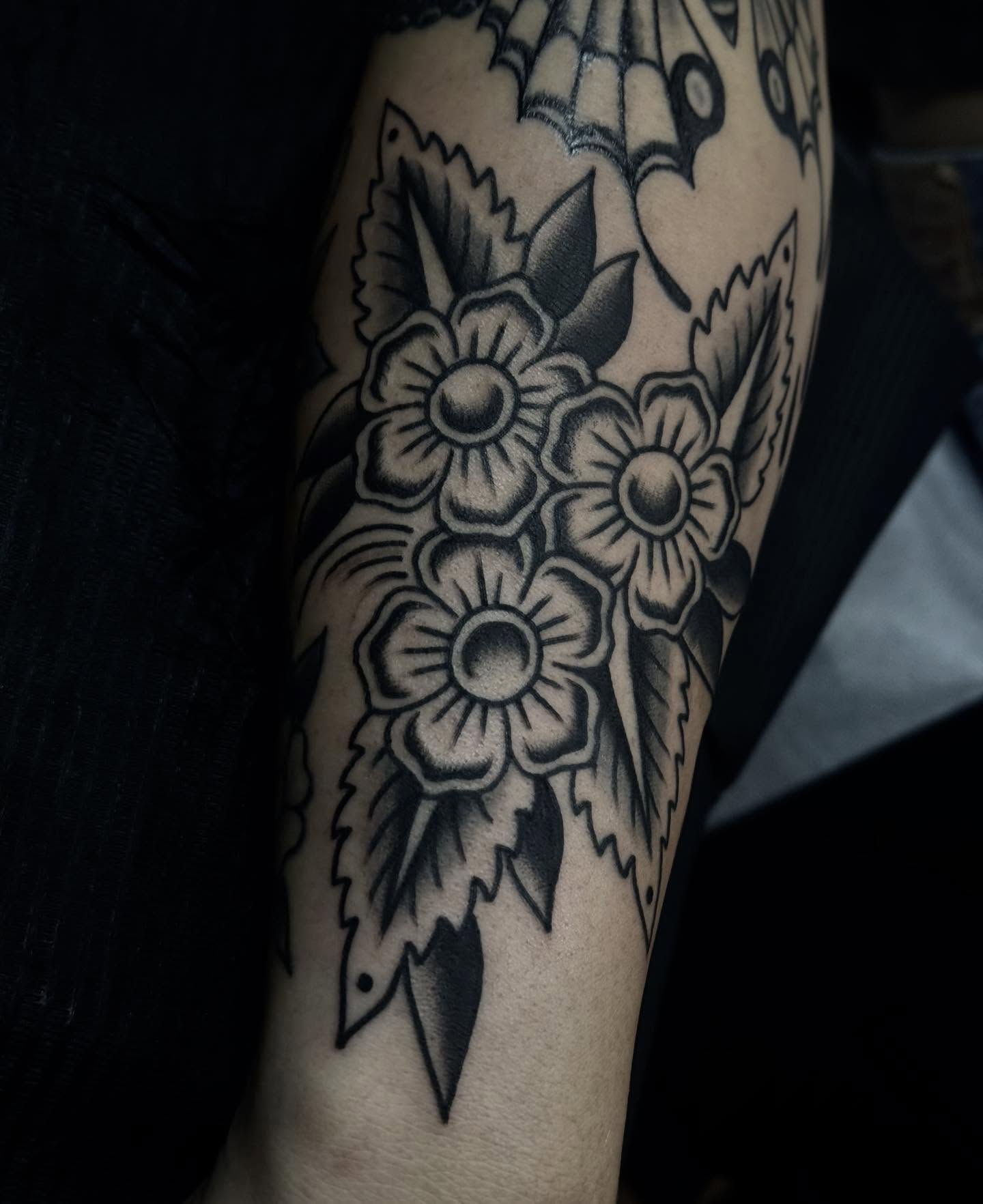 Flowers black and grey tattoo on the forearm by Ally noel