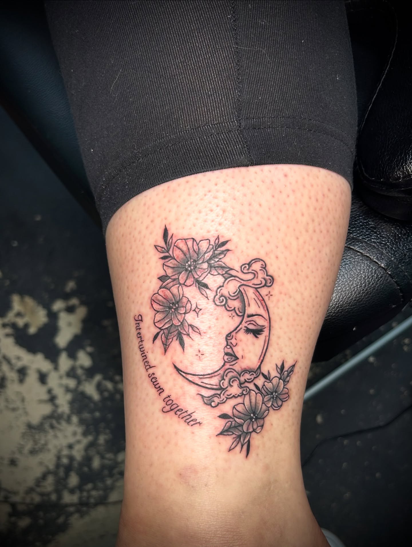 Moon and flowers black and grey tattoo on the forearm by Kiersten Tickle